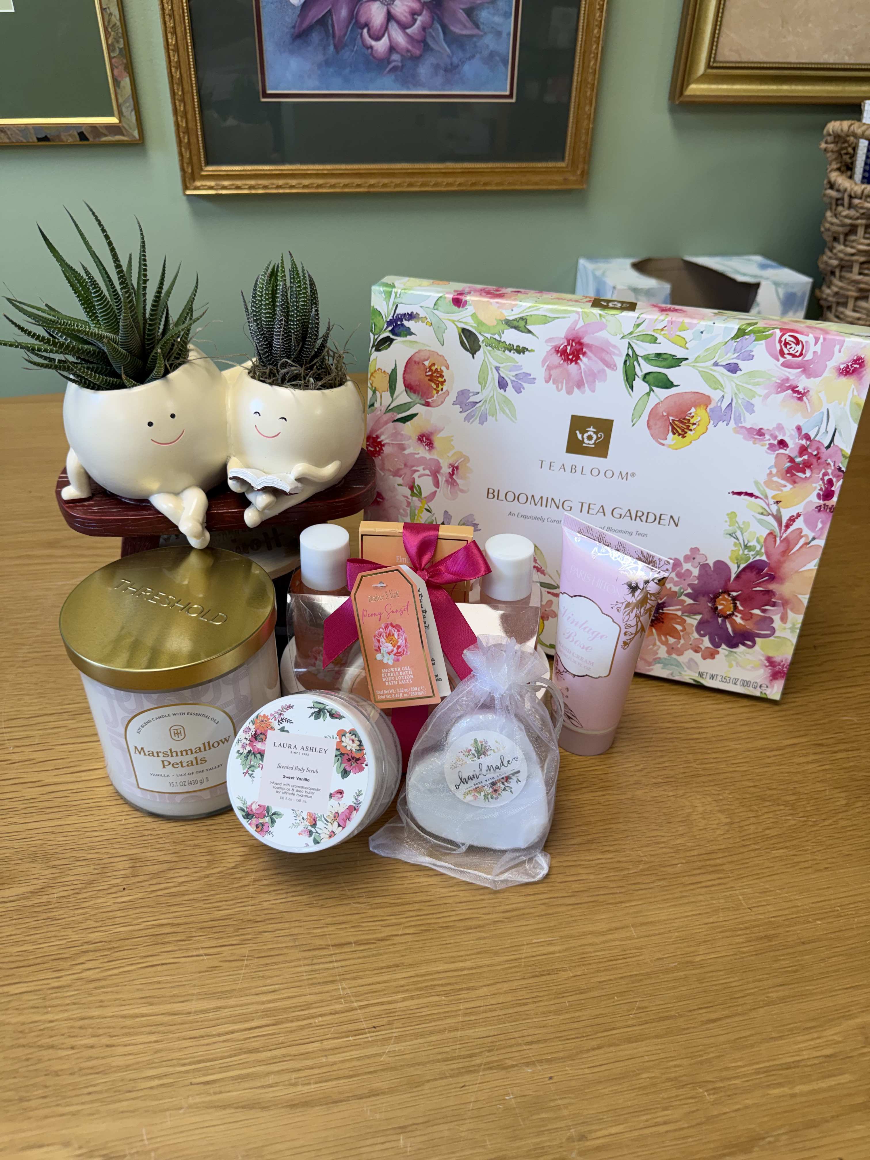 Gift set with two small potted succulents and floral bath products