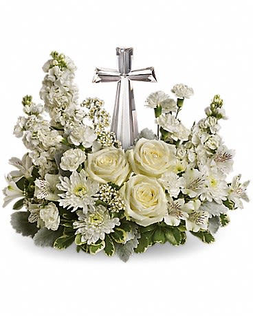 White floral wreath with roses and daisies around a silver cross