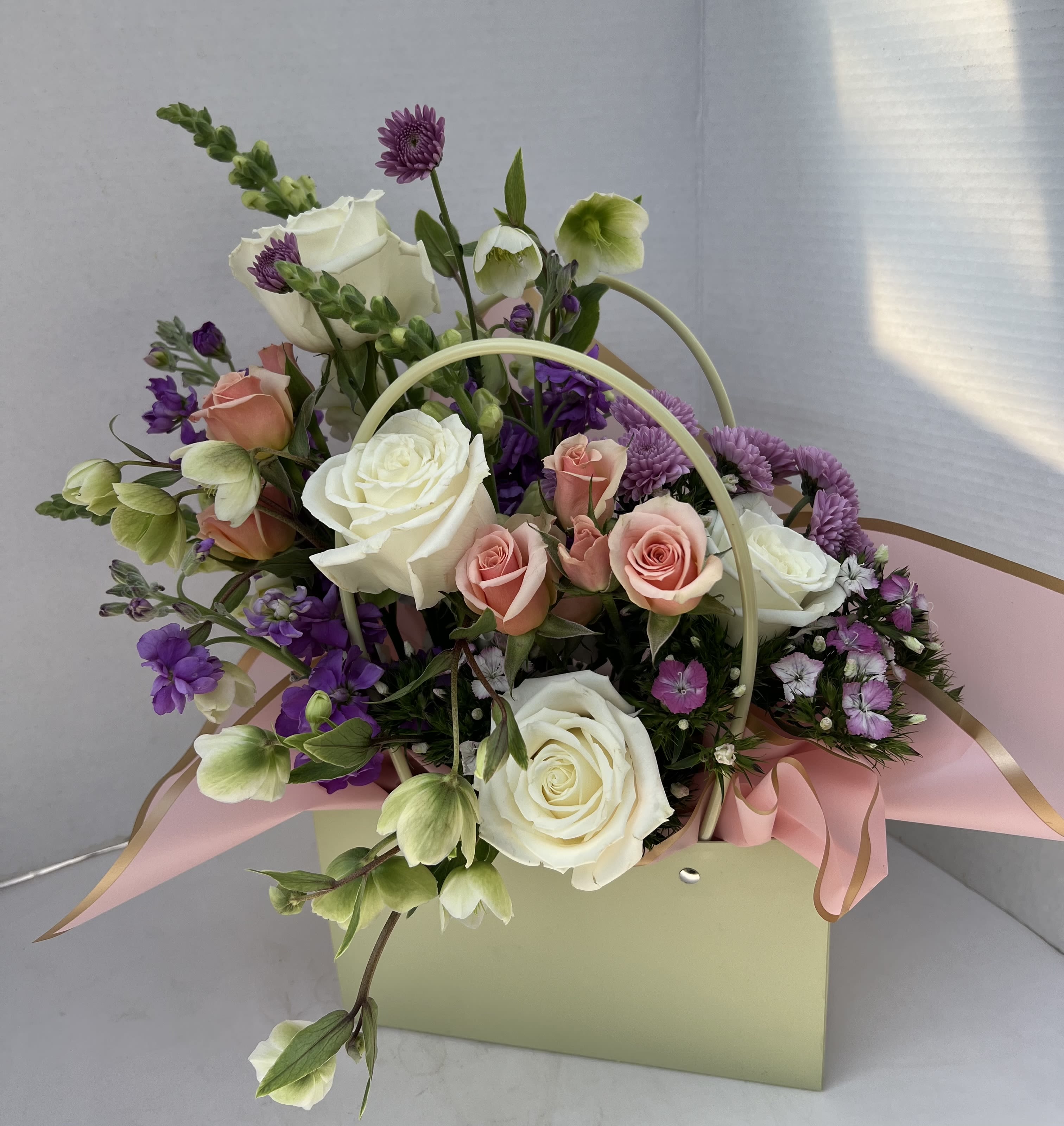 Pocket Full Of Posies - Our Blooming Purses are thoughtfully designed arrangements, blending soft, feminine colors with touches of vibrant and pastel tones. Each piece is uniquely styled, making no two exactly alike. Perfectly elegant and full of charm, they’re a lovely way to celebrate someone special.