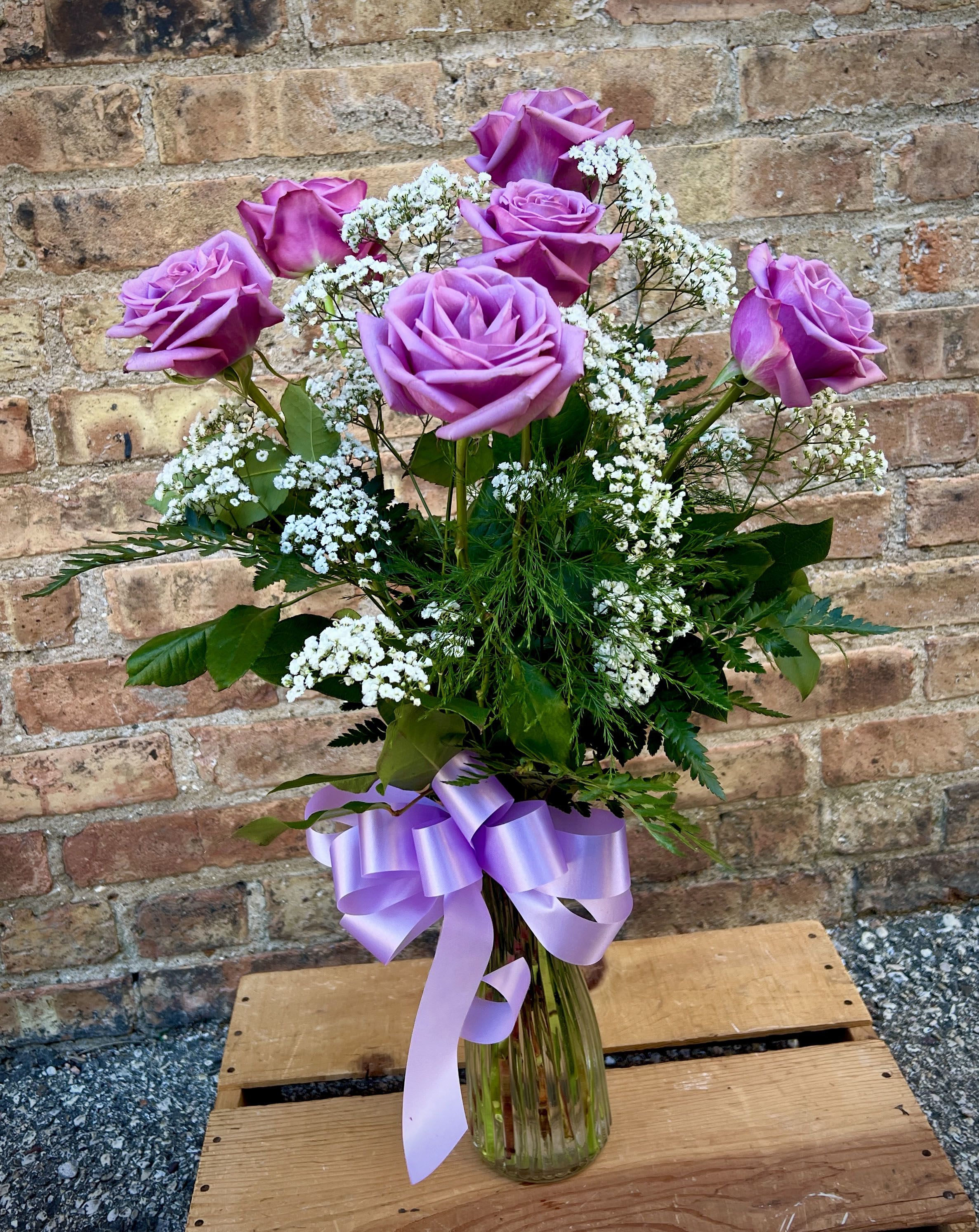6 Lavender Roses Arranged - 6 beautiful lavender roses are arranged in a vase with filler flowers and greens. The shade of lavender may vary from picture.  We are proud to deliver our flower creations to the Kenosha, Somers, and Pleasant Prairie area. With over 55 years of combined flower design experience in Kenosha, Wisconsin, A Summer's Garden Florist and Gifts is the perfect choice for the freshest flowers, the most creative design, and exceptional customer service.