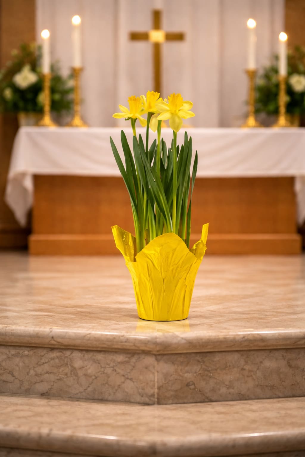 6” Potted Daffodils for Church - Ministry: Bring bright, cheerful color into your church space with blooming daffodil plants. With their unmistakable golden tones and clean, upright form, daffodils add a fresh, welcoming layer of color that instantly lifts the room.  Each 6-inch potted daffodil is selected for fullness and presentation, ready to be placed individually or grouped for a more impactful display. Their natural structure makes them easy to work into altars, entryways, and seasonal arrangements without overpowering the overall design.  Classic and instantly recognizable, daffodils are a natural choice for Easter, Passover, and spring church décor, bringing light, warmth, and a sense of renewal to the space.  Available for local delivery through Aspen Tower Florist, serving Greensburg and Shelbyville along with Rushville, Batesville, Westport, Oldenburg, St. Paul, Waldron, and Milroy. 