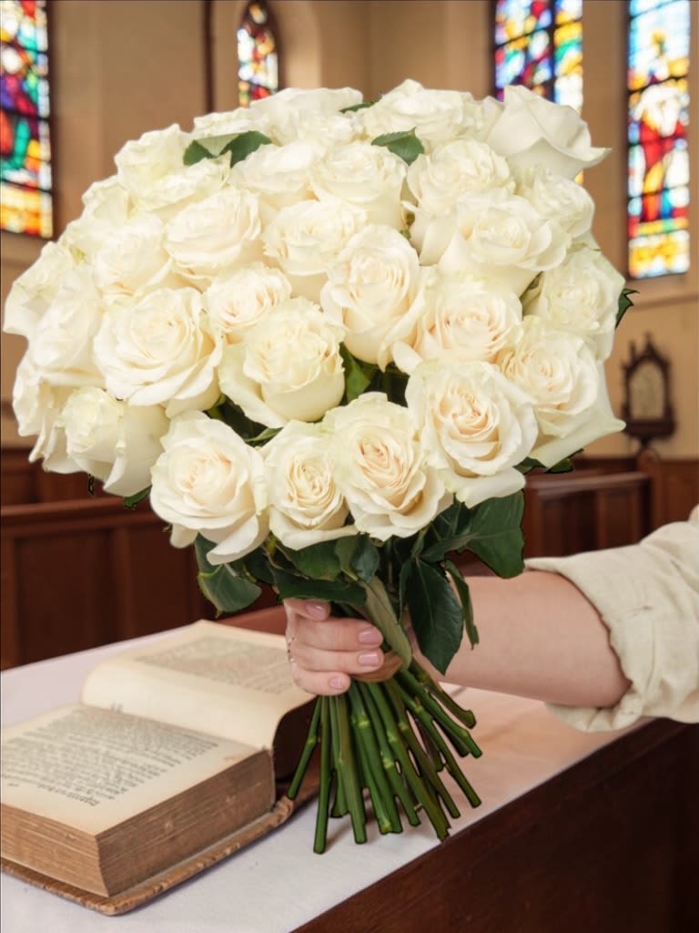 Bulk Church Service Roses - Ministry: Our bulk roses provide a clean, timeless option for church services, Easter and Passover observances, special services, and congregational events. Priced per stem and prepared for easy distribution, they’re ideal for honoring loved ones, altar placement, or meaningful moments within the service.  White is the standard offering for a classic, symbolic presentation, with additional color options available upon request prior to checkout.  Simple, elegant, and deeply meaningful, bulk roses remain one of the most versatile choices for church and ministry use.