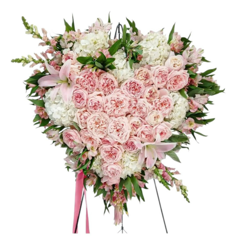 Premium Luxe Pink Rose Sympathy Heart Wreath - Please call first for availability. Please allow 48 hours notice. Send this beautiful heart felt tribute today to help them celebrate a live well lived with it's lovely premium pink roses, vanilla hydrangeas, lilies, stock and more designed as a heart wreath. Loving and heavenly. Perfect to send to the service. Always made extra special and with with care. Send them your deepest condolences. Local delivery to Haddon Township, Haddonfield, Cherry Hill, Mount Laurel, Moorestown and Voorhees NJ.