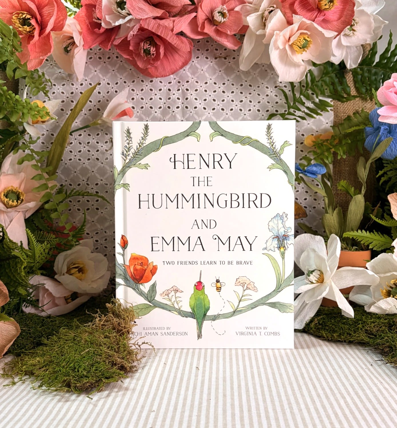 Henry the Hummingbird and Emma May - Best friends, Henry the Hummingbird and Honeybee Emma May, wish to flit and fly around their garden-home without a care…but their fear of the resident gardener is holding them back.  Illustrated in beautiful hand-painted watercolor, this children’s book is perfect for nature-lovers and brown-thumbers alike. Featuring a rhyming story, Henry the Hummingbird &amp; Emma May are sure to make an impression on little one’s minds. The bonus plant glossary in the back of the book may just spur on some flower scavenger hunting around your neighborhood or local botanic garden.