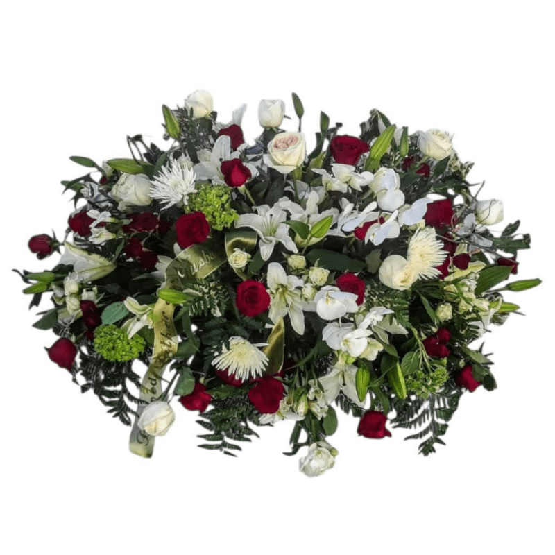 Large bouquet of red and white flowers with dark greenery