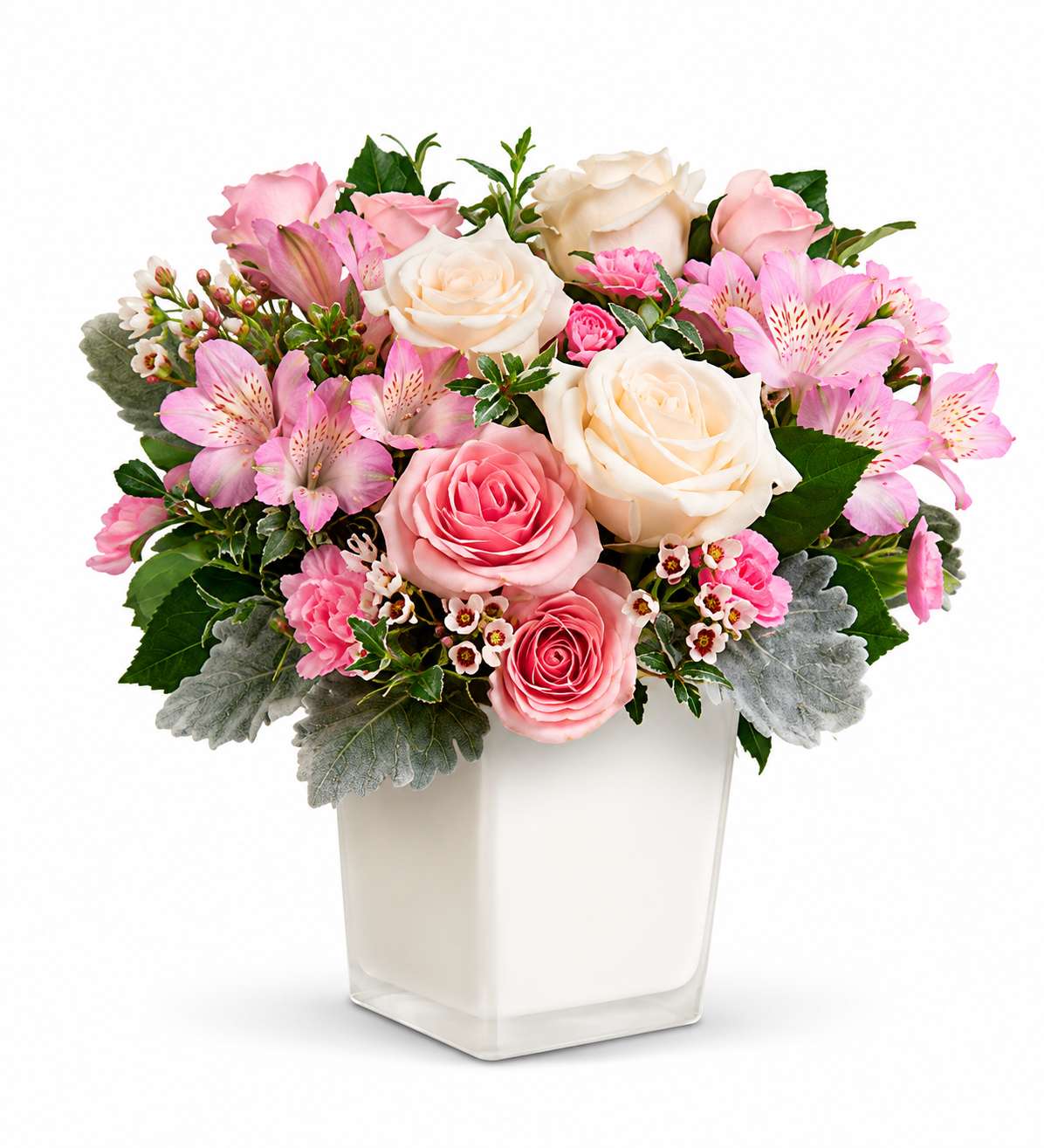 Pink and white rose bouquet in a square glass vase