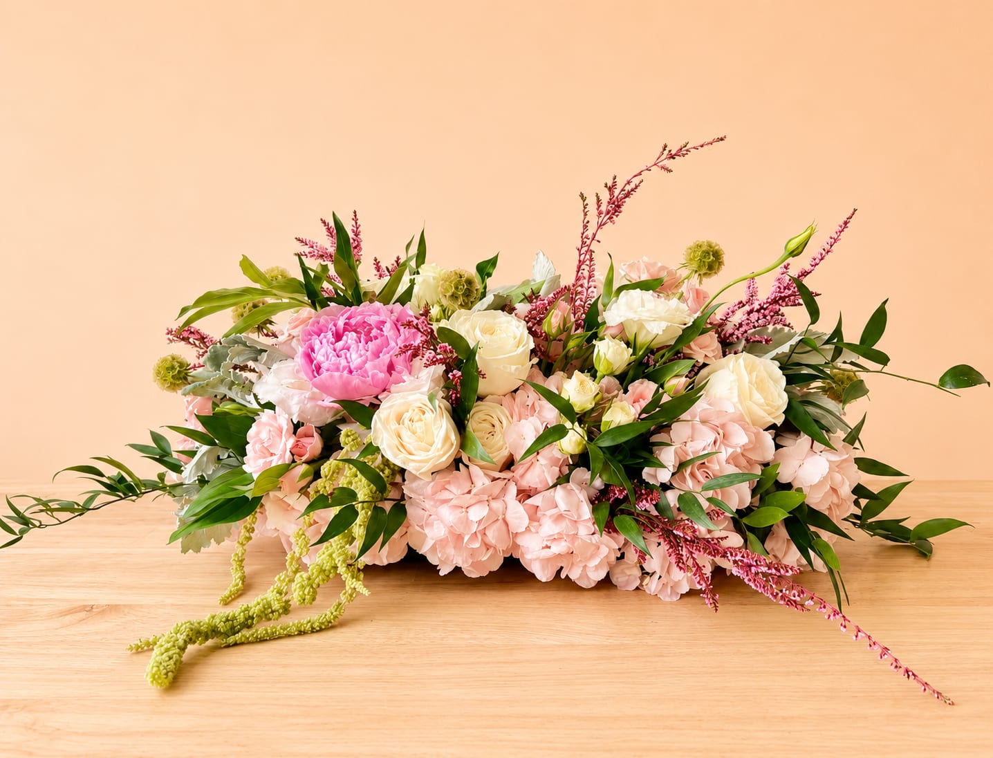 Strawberry Shortcake - Beautiful round arrangement with a mixture of roses, spray roses, greenery, and more. 