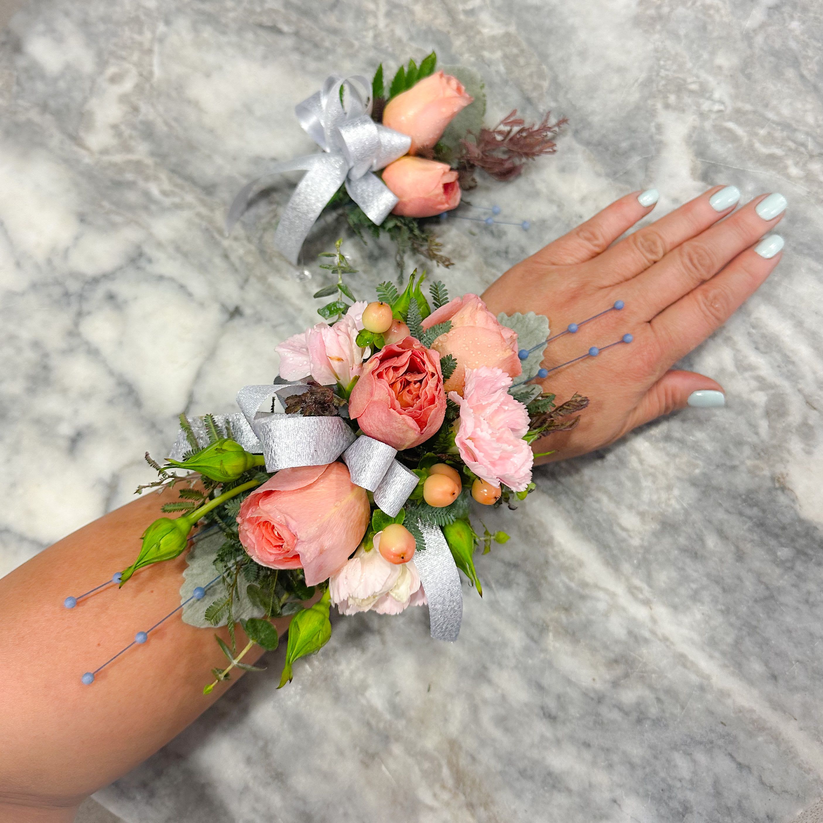 Corsage and Boutonnière Set - Corsage and Boutonnière set with spray roses, alstroemeria and baby’s breath accented with appropriate bow.  ***As this is a specialty product, please order at least 48 hours in advance to guarantee availability for pick up and delivery!  ***We can match the color of florals and choice of bow with your dress or suit. Please indicate your preference at “Special Instructions” at checkout.