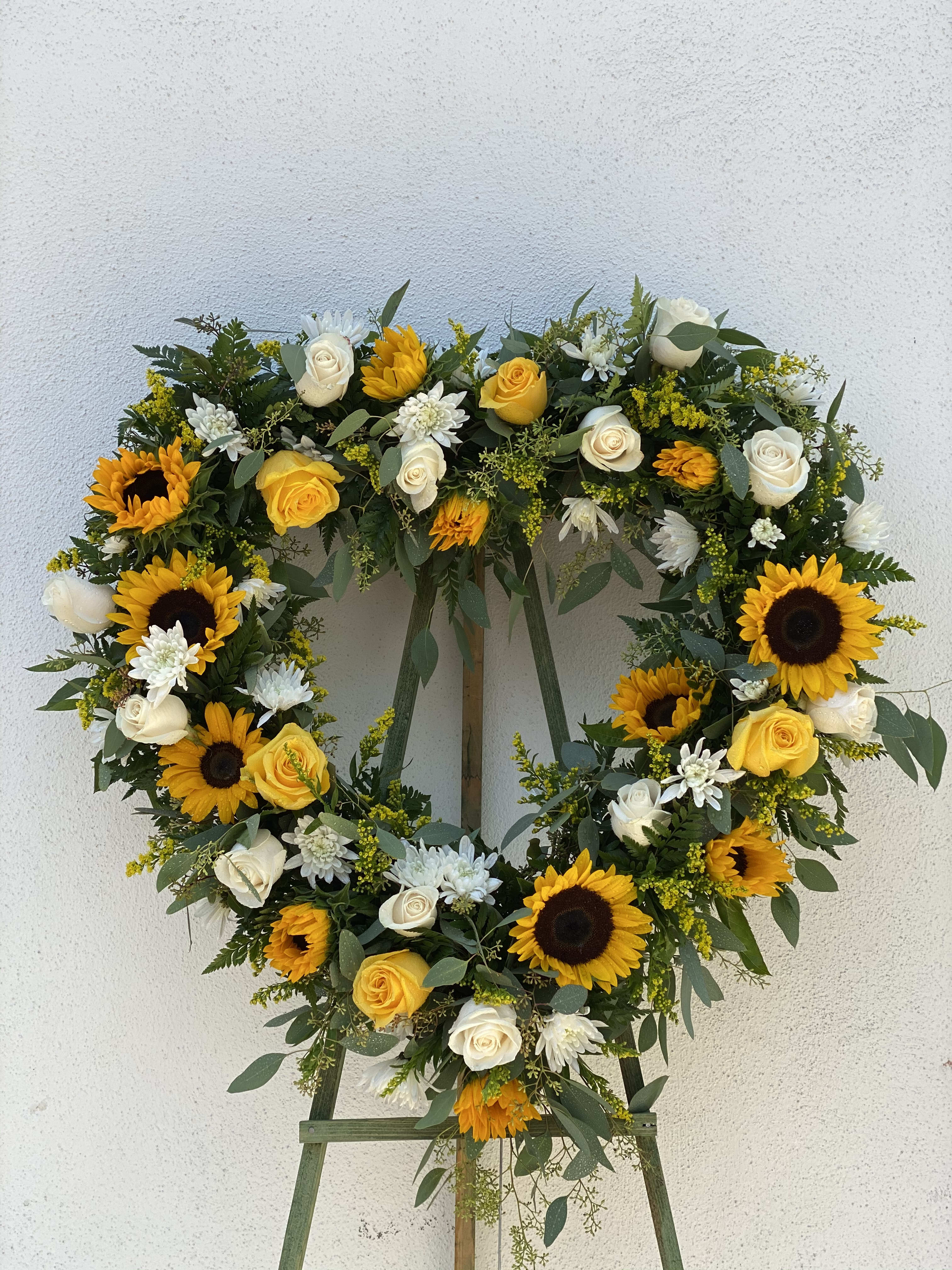 Yellow &amp; White Roses - Open heart is an assortment of sunflowers, yellow roses and carnations, white roses and cushion poms.