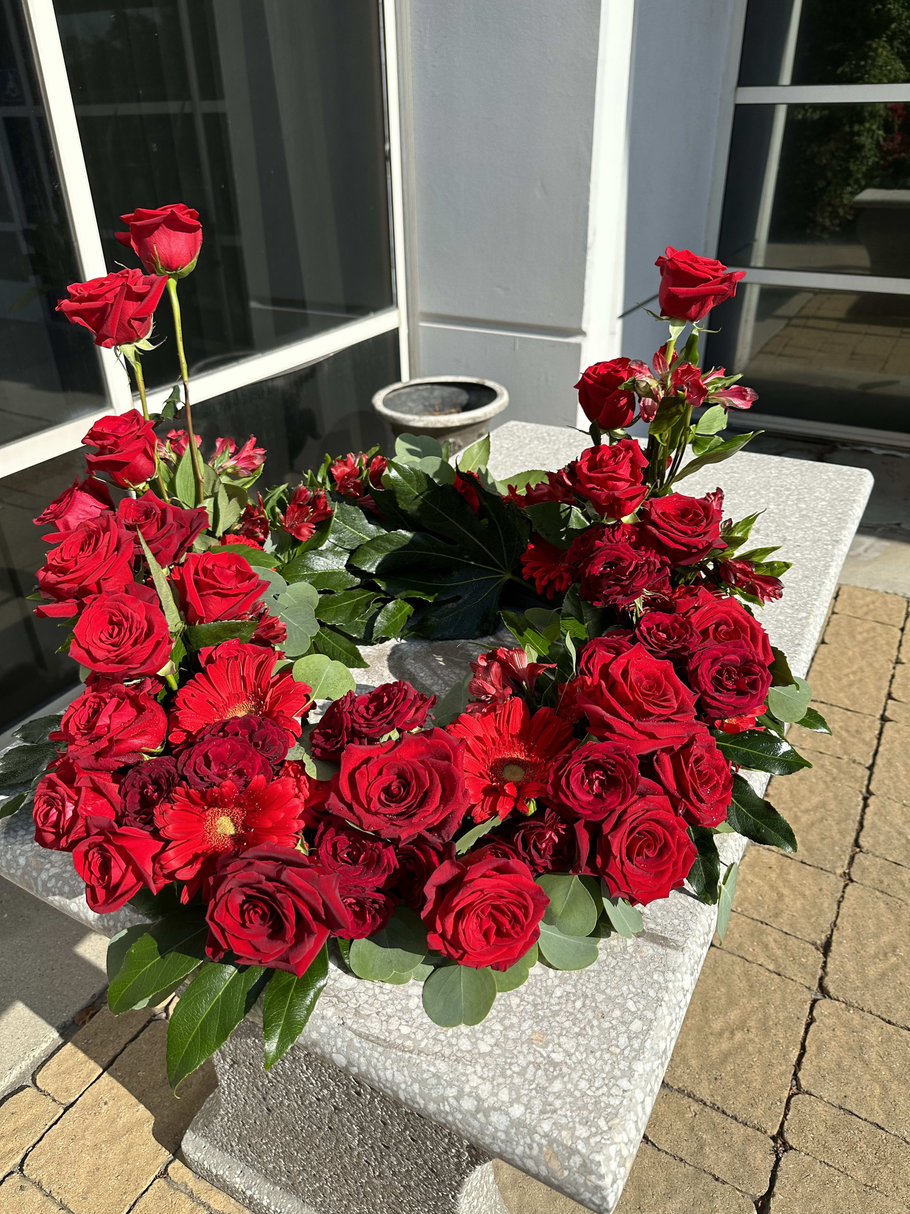 Red rose urn arrangement  - Gorgeous red flowers gerbera daisy, red roses, alstroemerias and carnations 