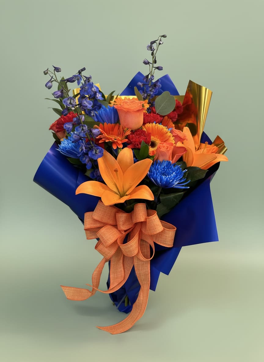 Sunset Sapphire Hand-Tied Bouquet - Turn heads with our stunning Sunset Sapphire Hand-Tied Bouquet, a vibrant floral design featuring premium orange lilies, peach roses, orange gerbera daisies, blue delphinium, and seasonal accent blooms. Wrapped in luxurious royal blue paper with metallic gold accents and finished with a coordinating satin bow, this bouquet is designed to make a lasting impression.  Perfect for birthdays, celebrations, congratulations, thank-you gifts, graduations, and just because moments, this colorful arrangement combines warm sunset tones with rich sapphire blues for a bold and unforgettable presentation. Handcrafted by the designers at Tommy Austin Florist using fresh, premium flowers, each bouquet is thoughtfully arranged to deliver beauty, elegance, and joy. Occasions: Birthday Flowers, Graduation Flowers, Congratulations Gifts, Thinking of You, Get Well Soon, Anniversary Flowers, and Everyday Celebrations. Gamer 
