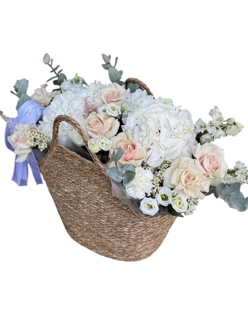 Stylish basket with flowers for a fashionable girl. - Stylish basket with flowers for a fashionable girl.