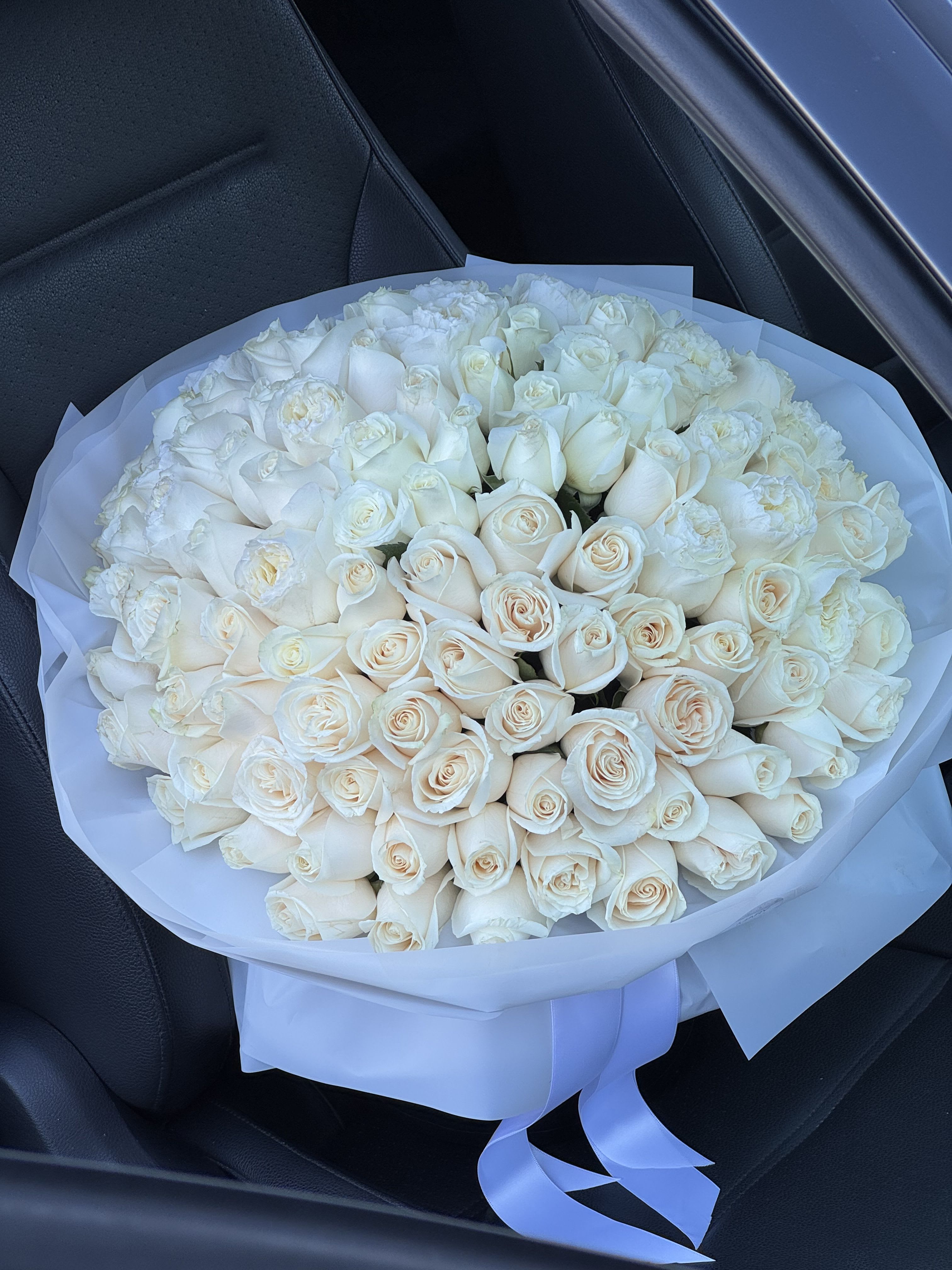 Large Bouquet of 125 Creamy White Roses: Luxury and Elegance in One Gift - Imagine holding in your hands a true masterpiece of floral art – a large bouquet of 125 creamy white roses. Each rose is a symbol of purity, tenderness, and refined beauty, and together they create an absolutely stunning visual effect.  This bouquet is not just flowers; it’s a work of art that will delight anyone who receives it. Creamy white roses represent sincere feelings, respect, devotion, and bright emotions. They are perfect for any special occasion: anniversaries, weddings, birthdays, corporate events, or declarations of love.  Features of this luxurious bouquet: 	•	125 creamy white roses – an impressive volume with a true “wow” effect. 	•	Freshly cut blooms – each rose is carefully selected to ensure it delights with its beauty for as long as possible. 	•	Elegant packaging – attention to every detail: stylish paper, ribbons, and decorative elements highlight the gift’s sophistication. 	•	Symbolism of the creamy white color – purity, harmony, elegance, and timeless style.  This bouquet is the perfect gift for someone special or a striking centerpiece for a festive occasion. It not only pleases the eye but also creates an atmosphere of warmth, care, and luxury.  If you want to truly impress and touch the heart, a large bouquet of 125 creamy white roses is a choice that will leave a lasting memory. Give emotions that will be remembered forever!