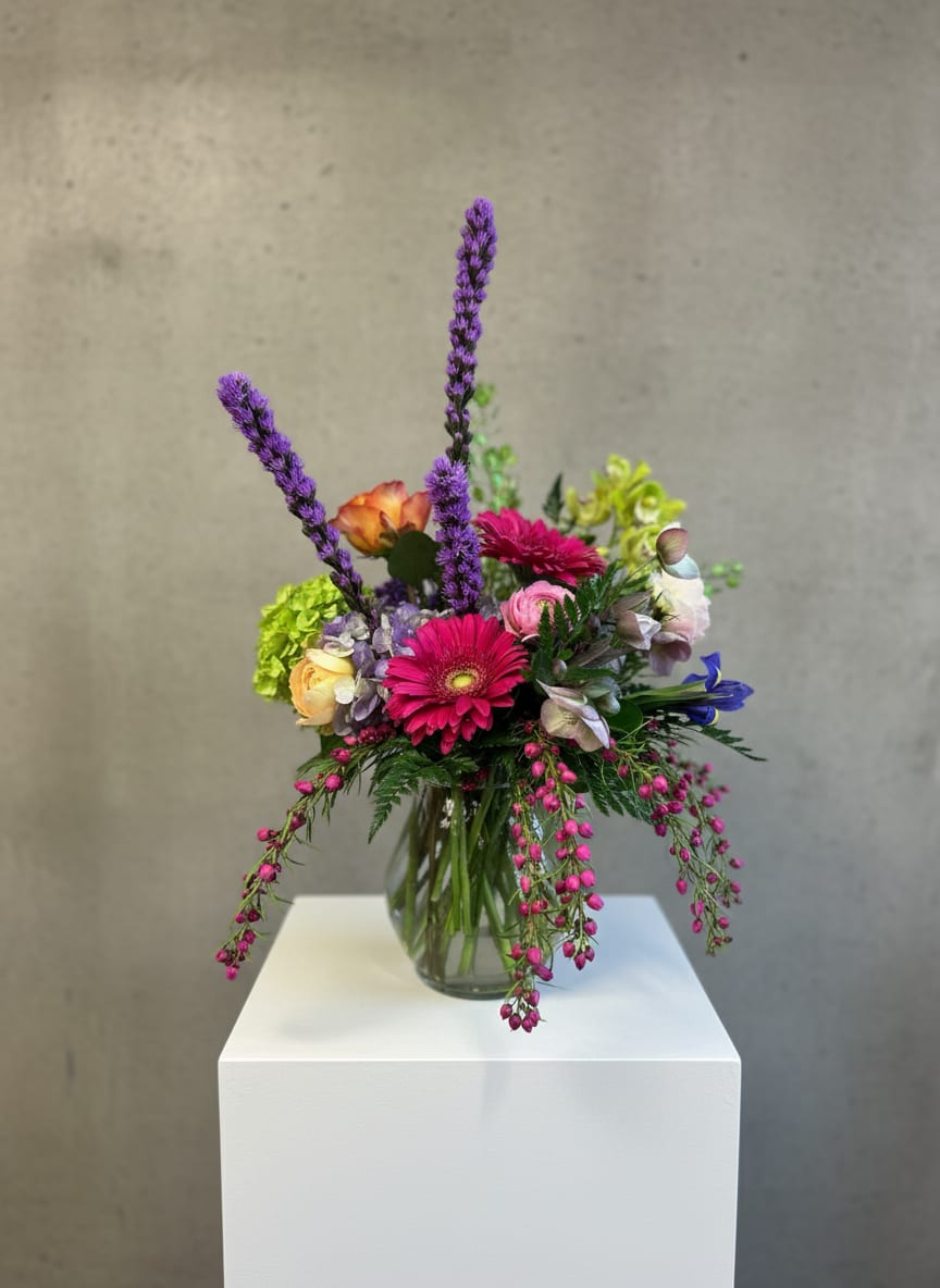 Colorful mixed bouquet in a clear glass vase