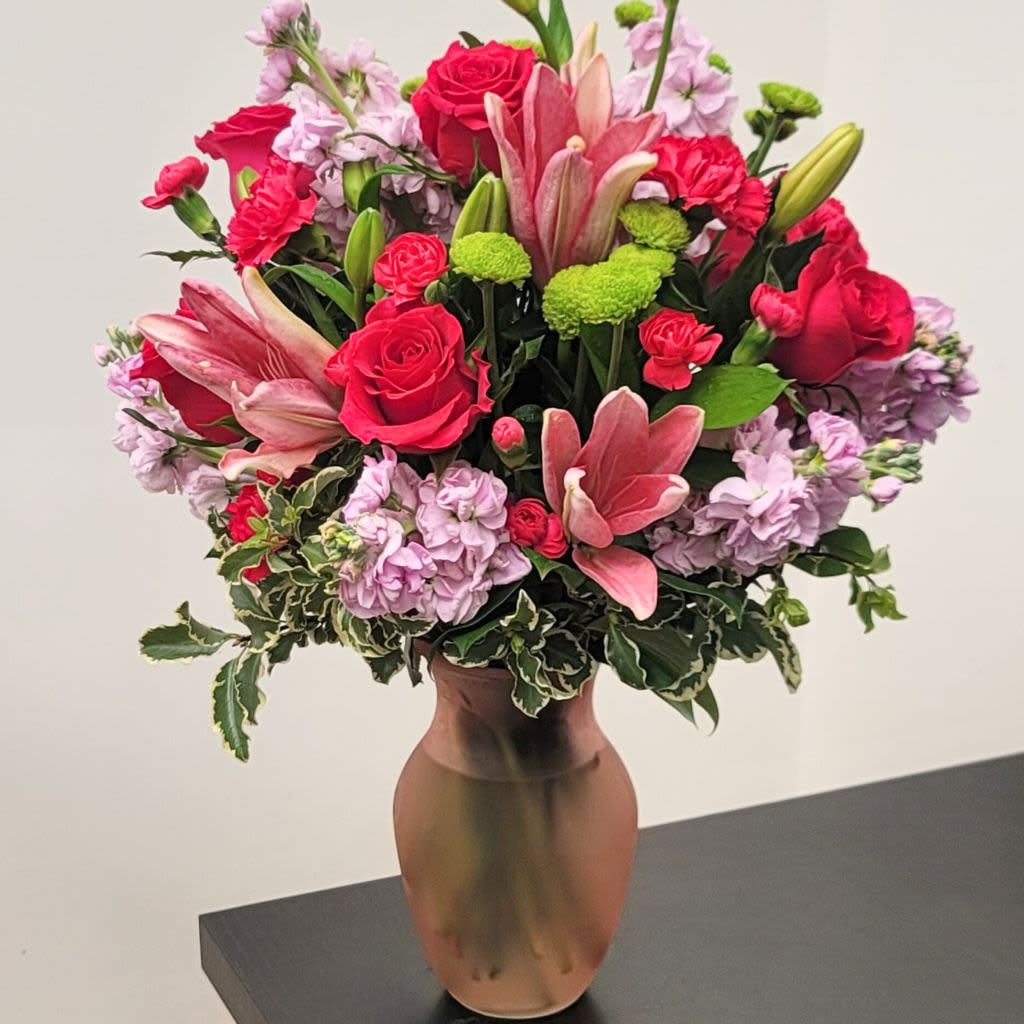 Pink and red flower arrangement in a vase