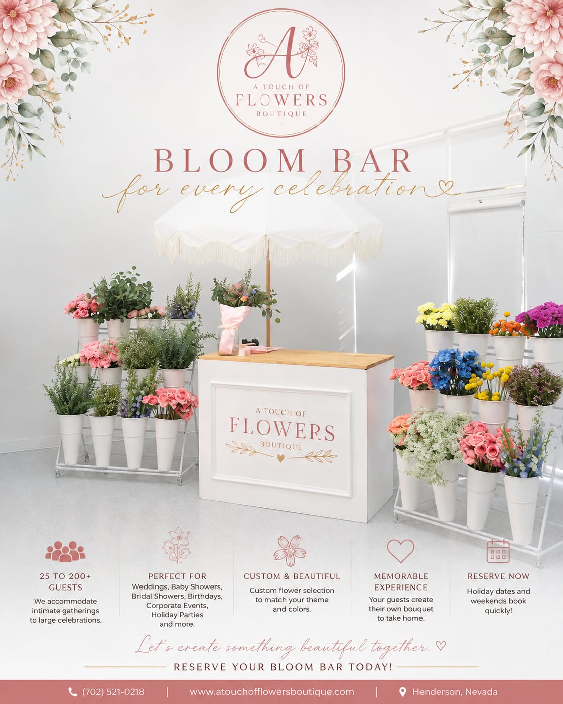 Bloom bar display with assorted flowers in white buckets under a canopy