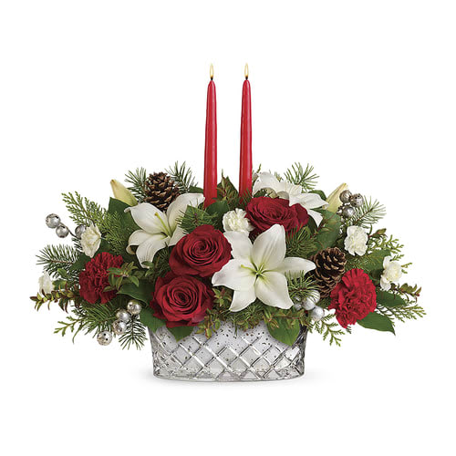 Sparkling Season Centerpiece - 'Tis the season to sparkle! Capture the joyful magic of the holiday season with this stunning crosscut mercury glass bowl, filled with Christmas roses and lit by glowing tapers. This sparkling centerpiece features red roses, white asiatic lilies, red carnations, miniature white carnations, red huckleberry, flat cedar, douglas fir, lemon leaf, and two red candles. Delivered in a Merry Mercury Bowl. Approximately 20 1/2" W x 16" H 
