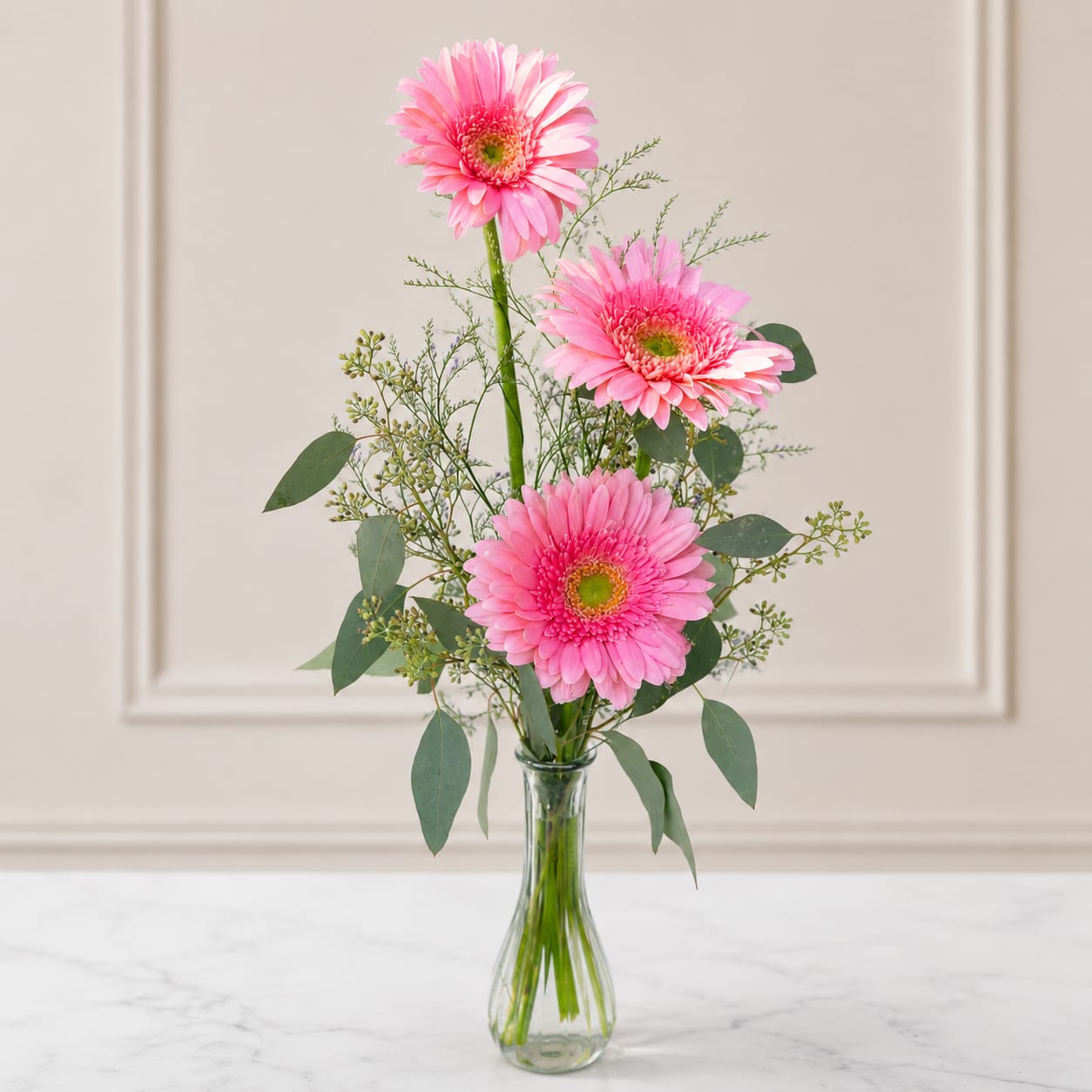 3 pink gerbera bud vase - Classic gorgeous pink Dutch gerbera daisies complimented with Greenery and light filler. Perfect gift for anyone!