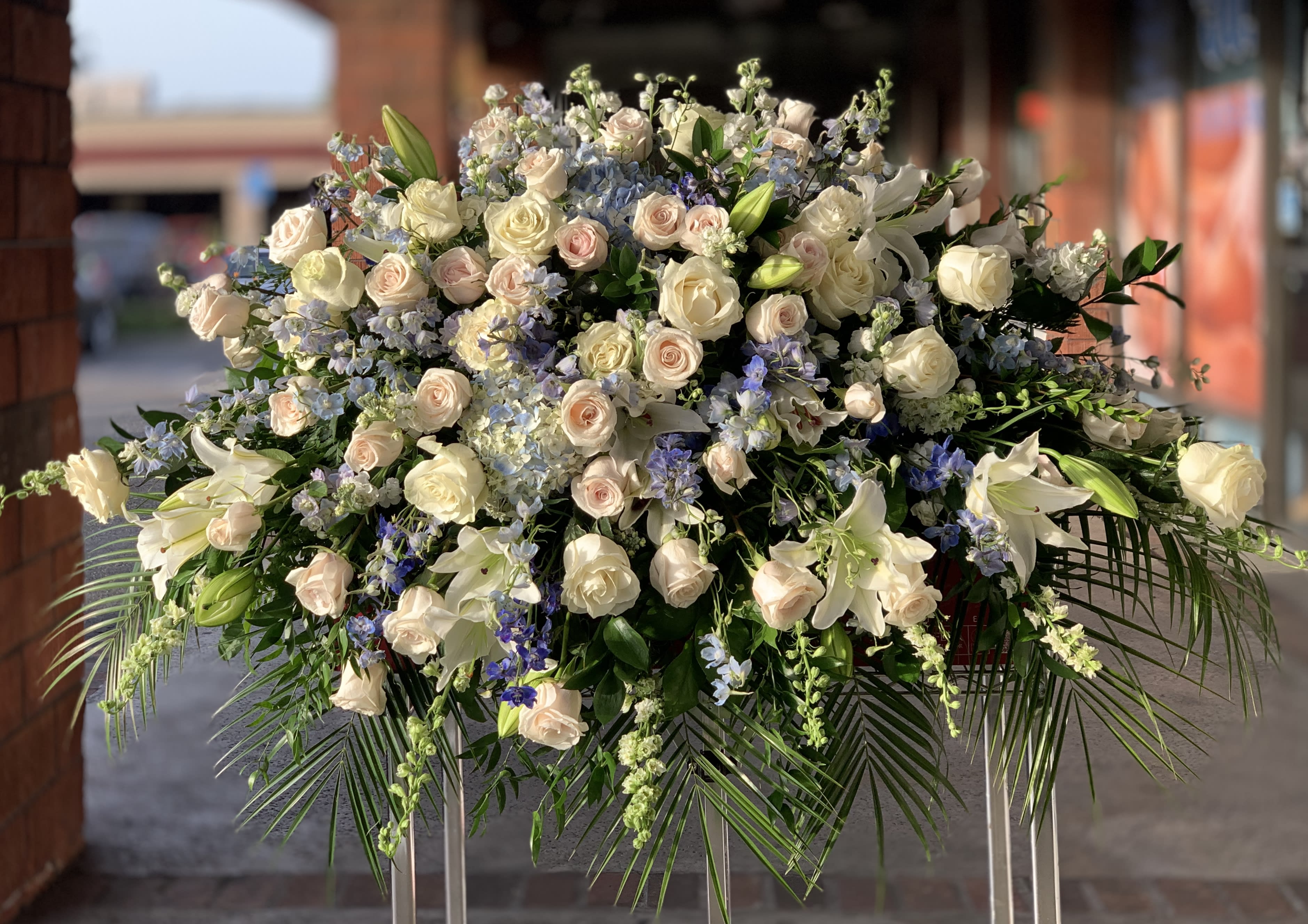 Large white and blush floral spray with lilies and roses