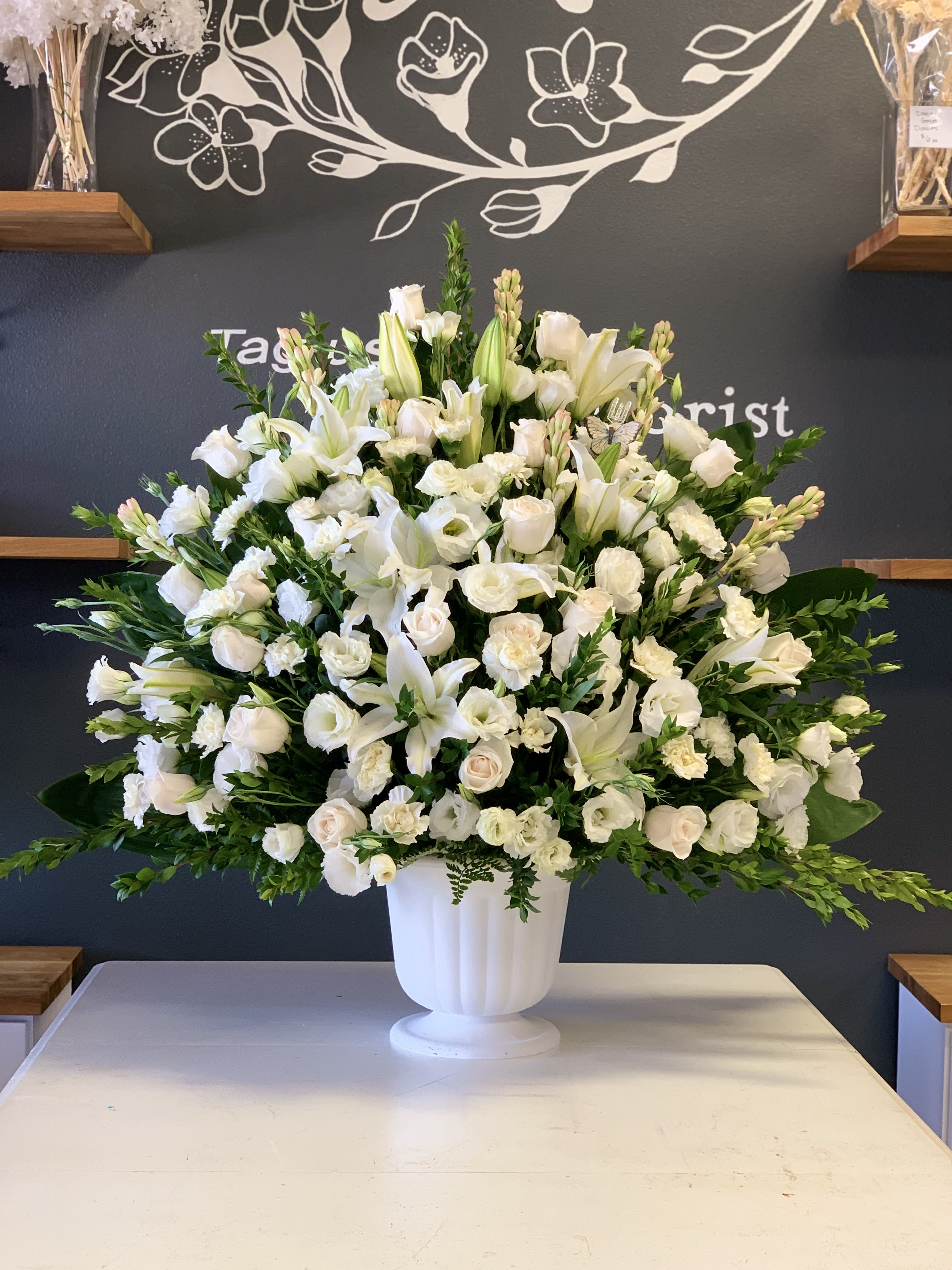 White Sympathy  - A beautiful display of all white flowers – including such bright blossoms as gladiolas,  roses and stock – will show your thoughtfulness and sentimentality. It’s as clean and pure as a fresh winter snowstorm.
