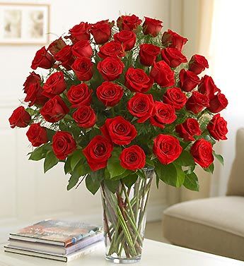 Bouquet of red roses in a clear glass vase