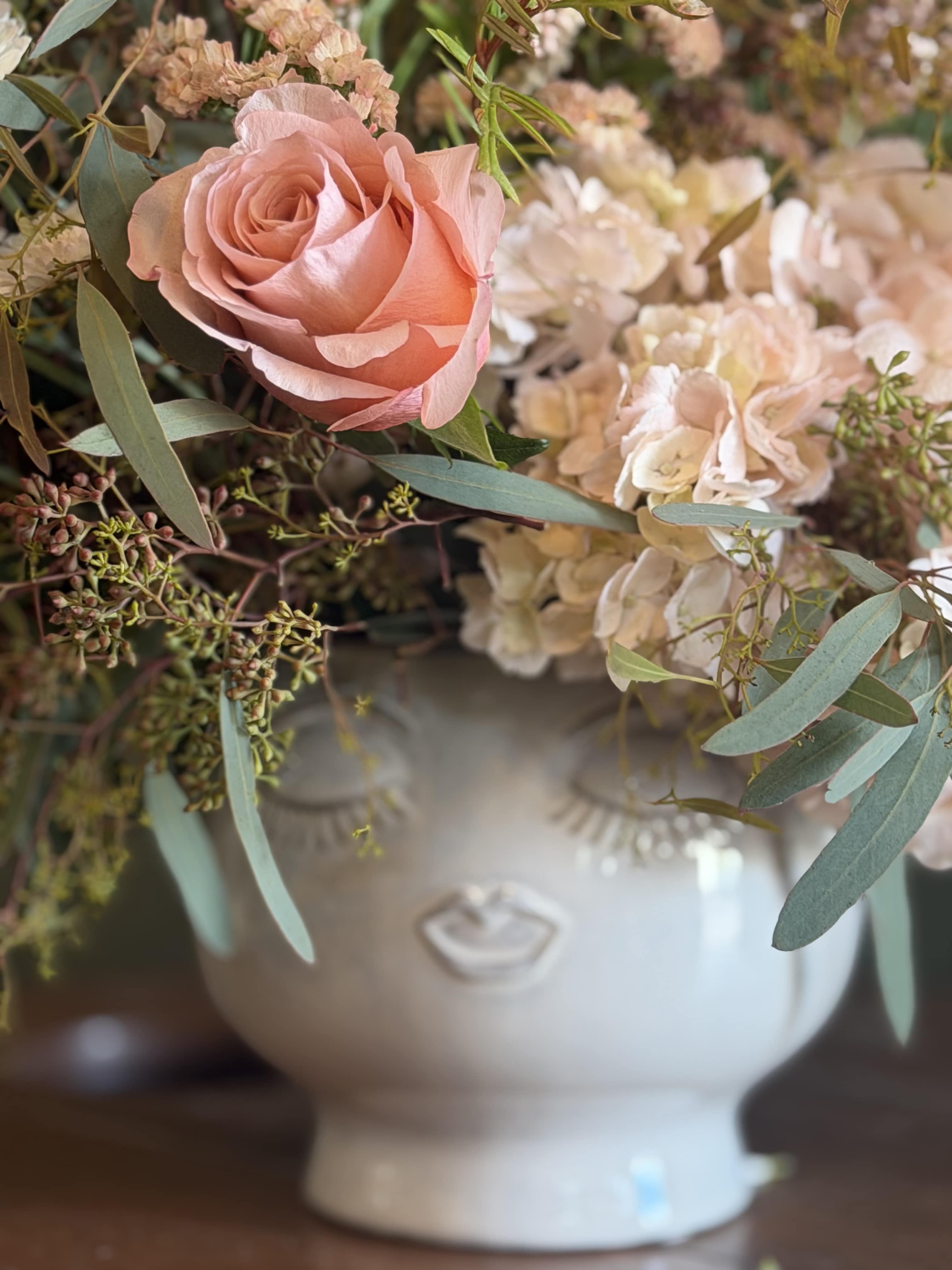 Mother Nature  - A soft, garden-style arrangement that reads as gentle and effortlessly romantic. The rounded composition of blush and cream roses, pale hydrangea clusters, pink chrysanthemums and mixed filler creates a layered, hand-gathered look that makes the person you're thinking of feel truly seen and cherished.  