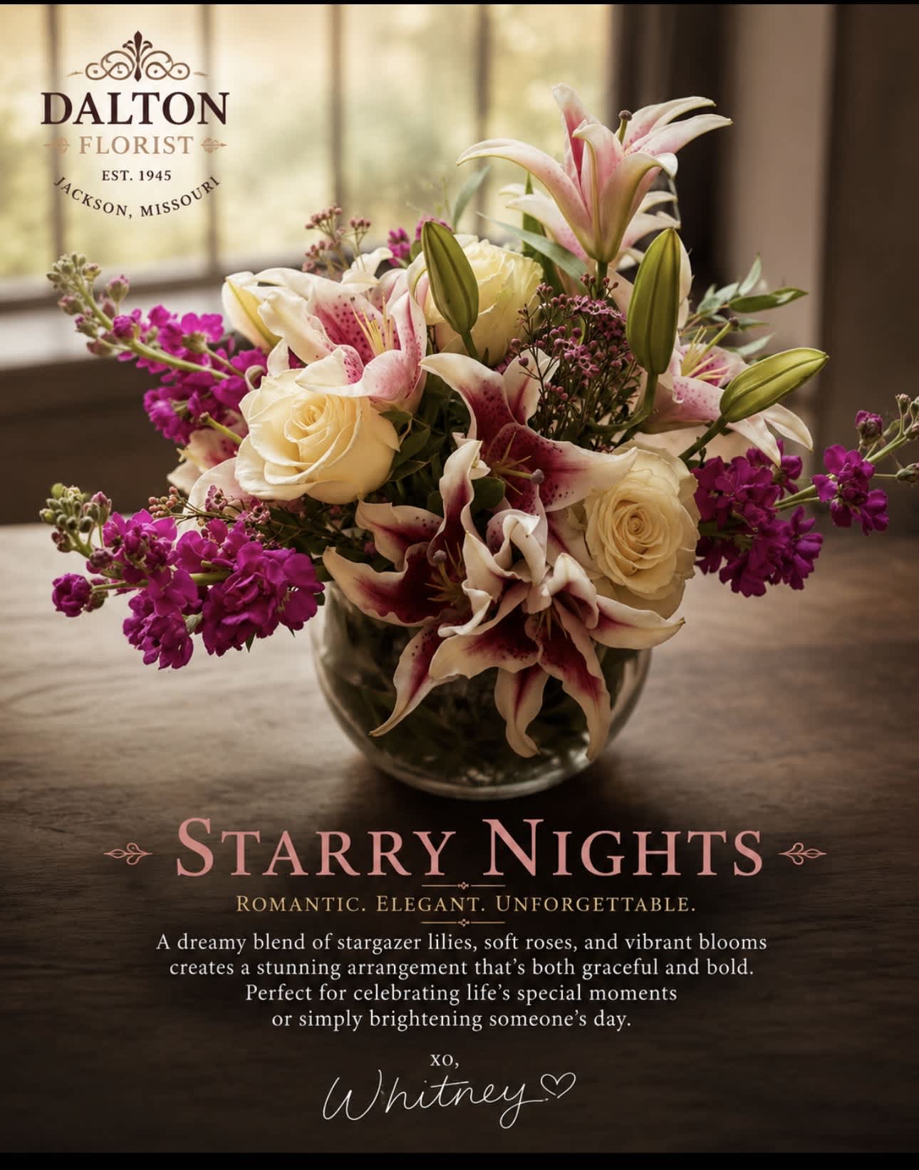 Bouquet of pink lilies, cream roses, and purple blooms in a glass vase