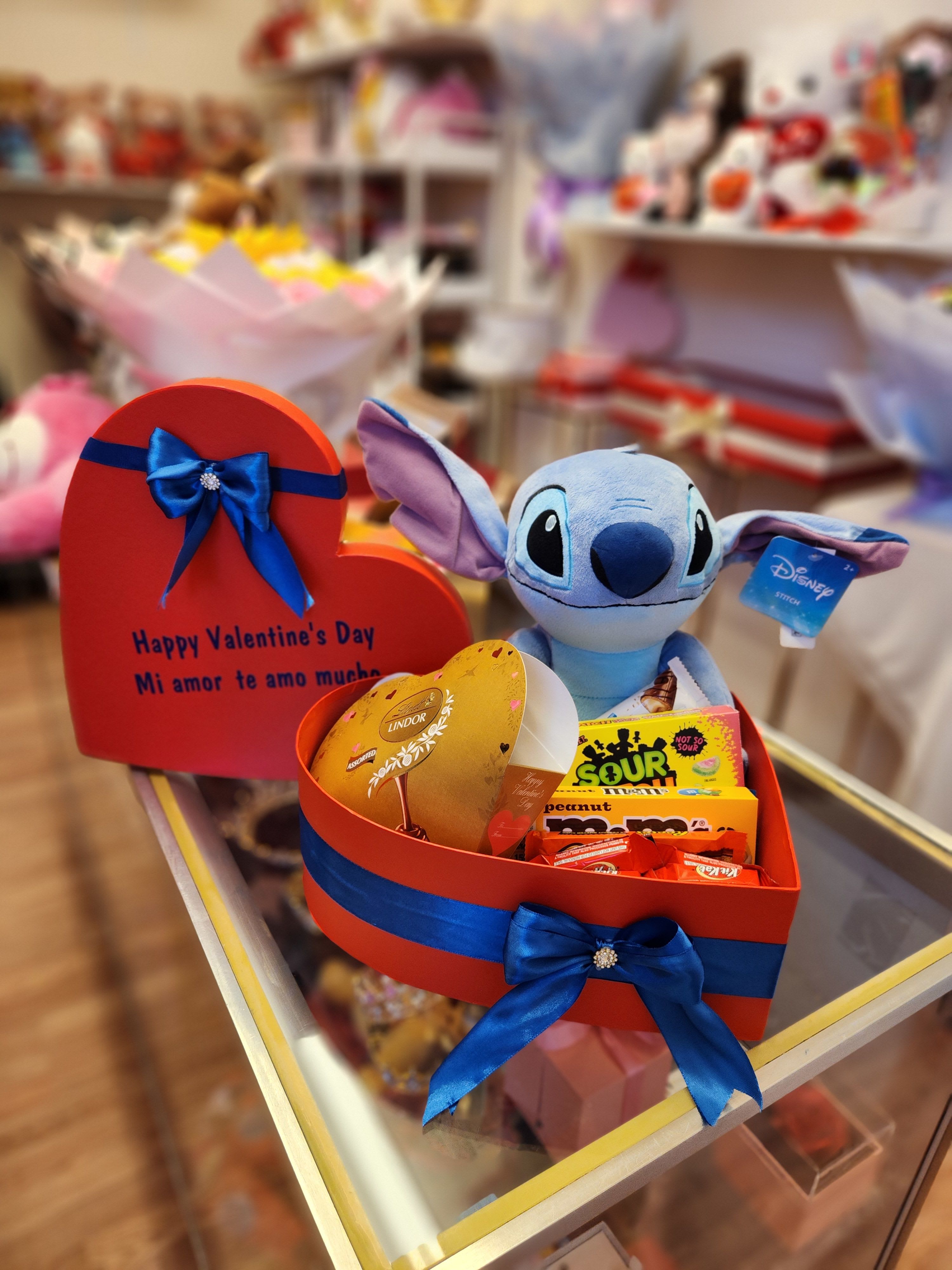 Heart-shaped gift box with candy and a Stitch plush toy