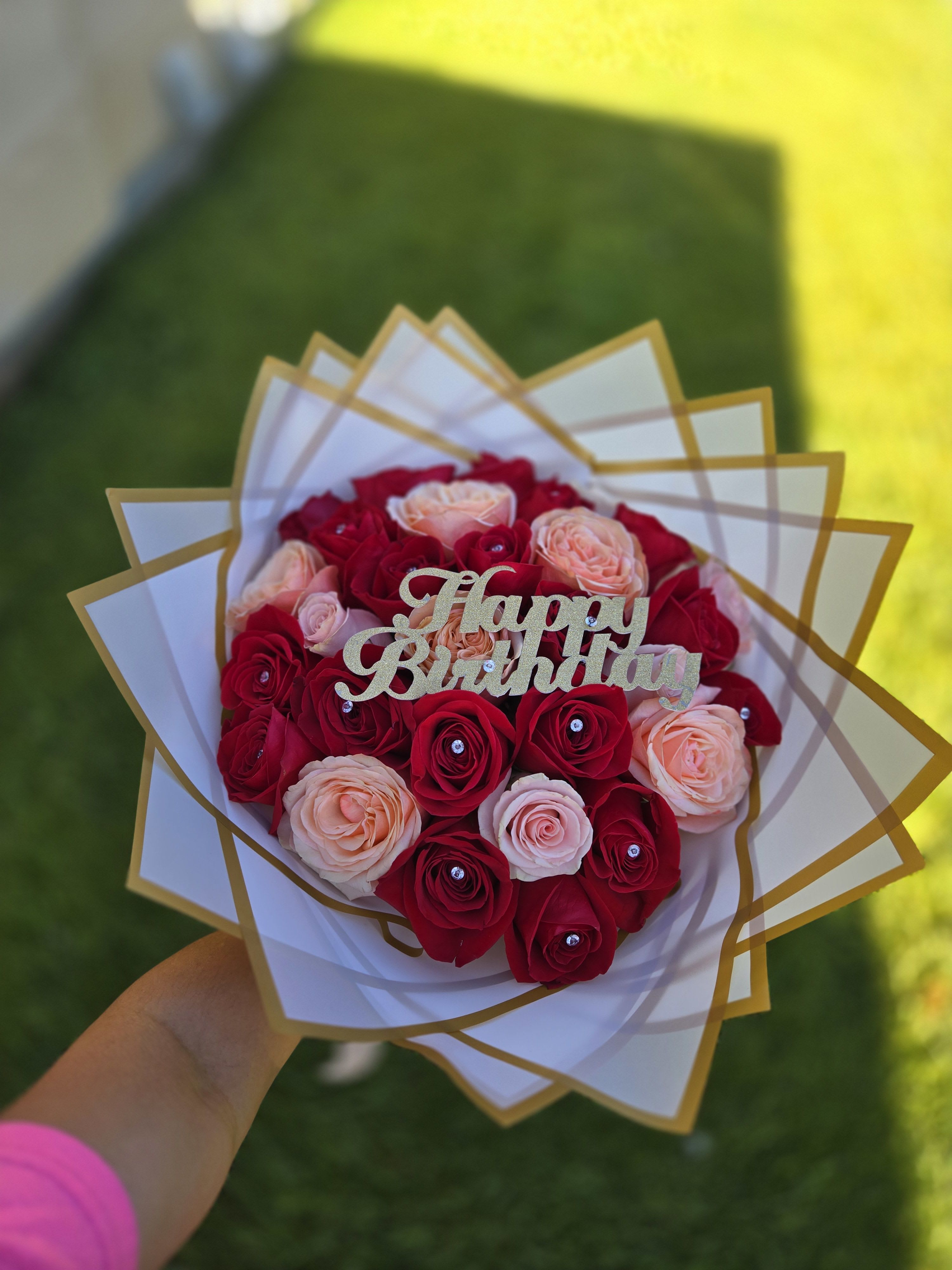 Bouquet of red and blush roses with a Happy Birthday topper