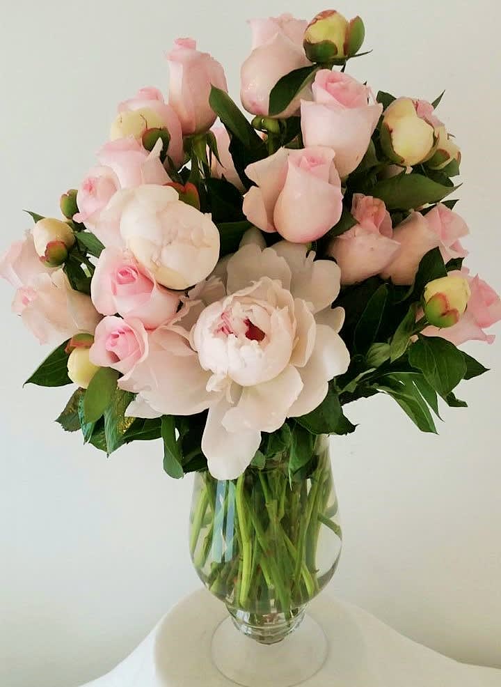 From Russia With Love - We have combined those perennial Russian (and everybody's) favorites, peonies and roses, into one unbeatable arrangement.  This will win everyone's heart!   Pictured is the premium version (24 roses and 20 peonies)