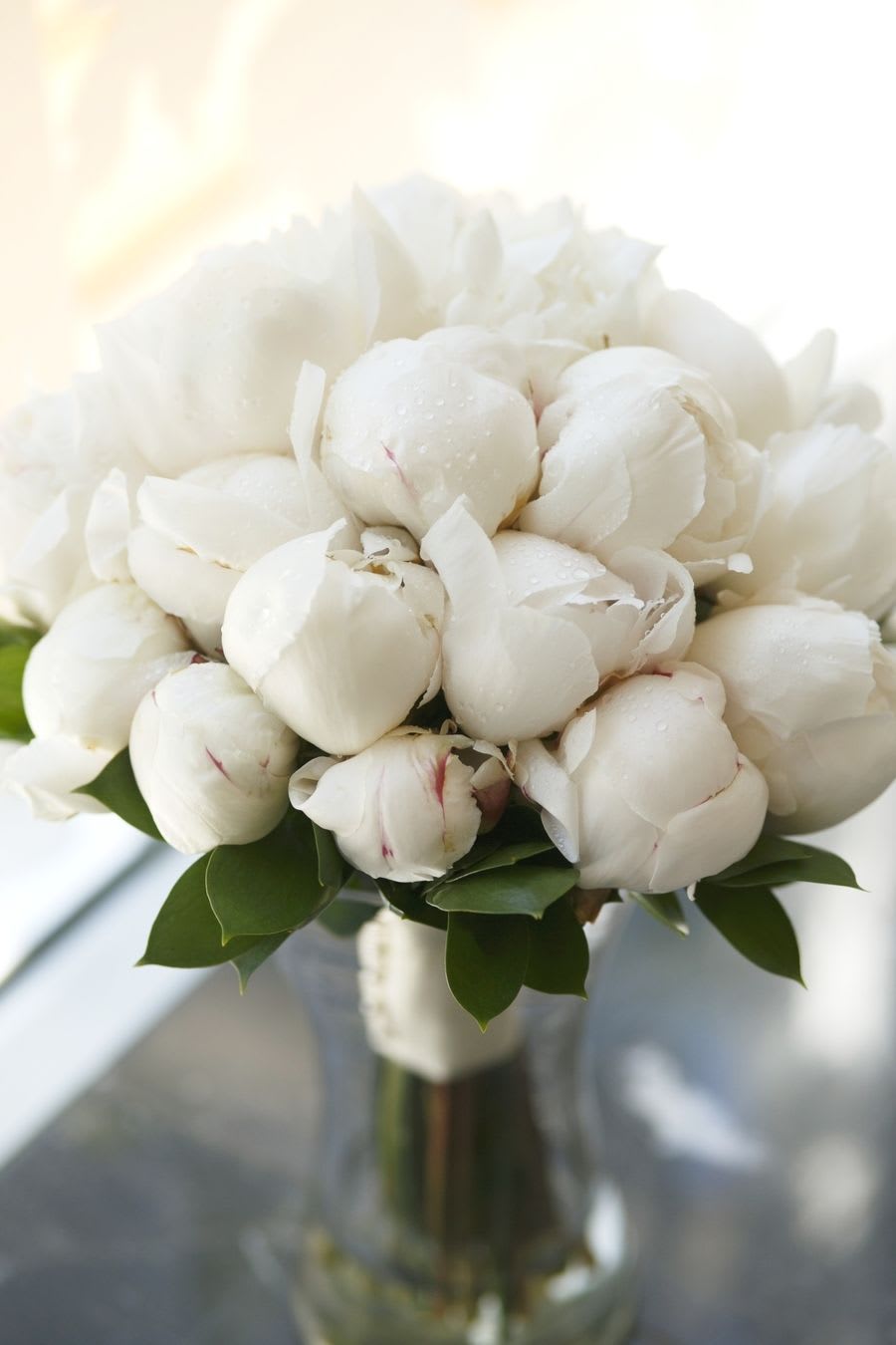 White peony bouquet in a glass vase