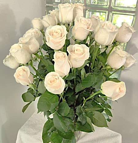 Bouquet of white roses with green foliage
