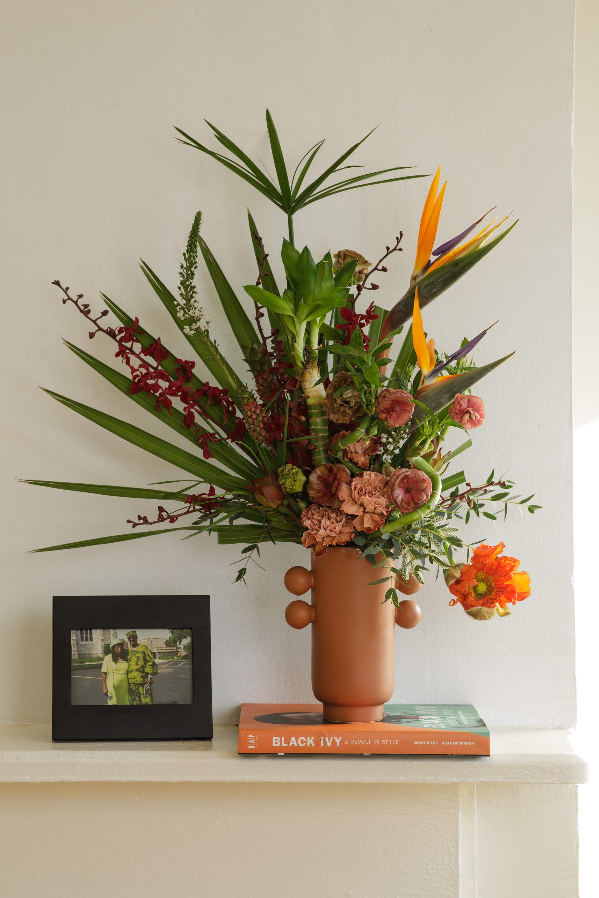 Bamboo &amp; Blooms Collection: The Mother Gaston  - "The Mother Gaston" is our luxe modern arrangement created in a ceramic vase. By using Lucky Bamboo and pairing with complimenting luxe blooms this design is sure to be a sculpturally engaging arrangement for any space. Once the flowers have gone through it's life cycle enjoy the Lucky Bamboo in a beautiful vessel.  **Please note that Brooklyn Blooms move with the seasons, vessels, blooms, and foliage will vary from what you see in the photo. However, it will have the same beauty, uniqueness, and funky style. Please let us know in the florist notes if you have any color preferences, or special requests or love what's in the photo, otherwise, the Bloomies will make a tasteful decision for you! **  ***ALL SPECIAL REQUESTS MUST BE SPECIFIED IN THE FLORIST NOTES SO THAT OUR BLOOMIES ARE AWARE AND CAN DELIVER THE BEST SERVICE. COMMUNICATION IS KEY!!****  Upgrade Notes: Please note that with each upgrade the Bloomies will choose a mix of blooms, premium foliages, and filler to enhance your arrangement for the best presentation!  