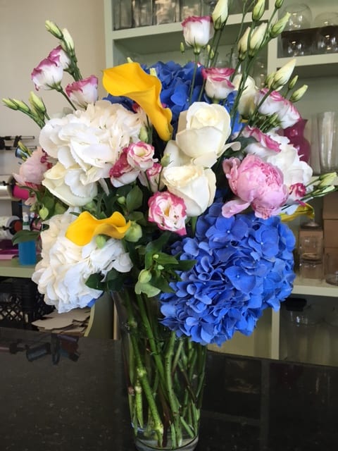 Westhampton Beach - Standing tall at about 30 inches - This arrangement of finest Dutch Flowers arranged in a 12 or 14 inch glass cylinder vase (4-5 inches wide at the top ) is sure to please recipient. - When only the best arrangement will do, this is the one to ask for - Including Dutch Hydrangea - Pink Peony - Calla's and a variety of seasonal Dutch Flowers. - Available for Local delivery to the Hampton's only.