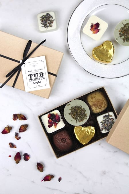 Gift boxes of assorted chocolates with dried flower petals