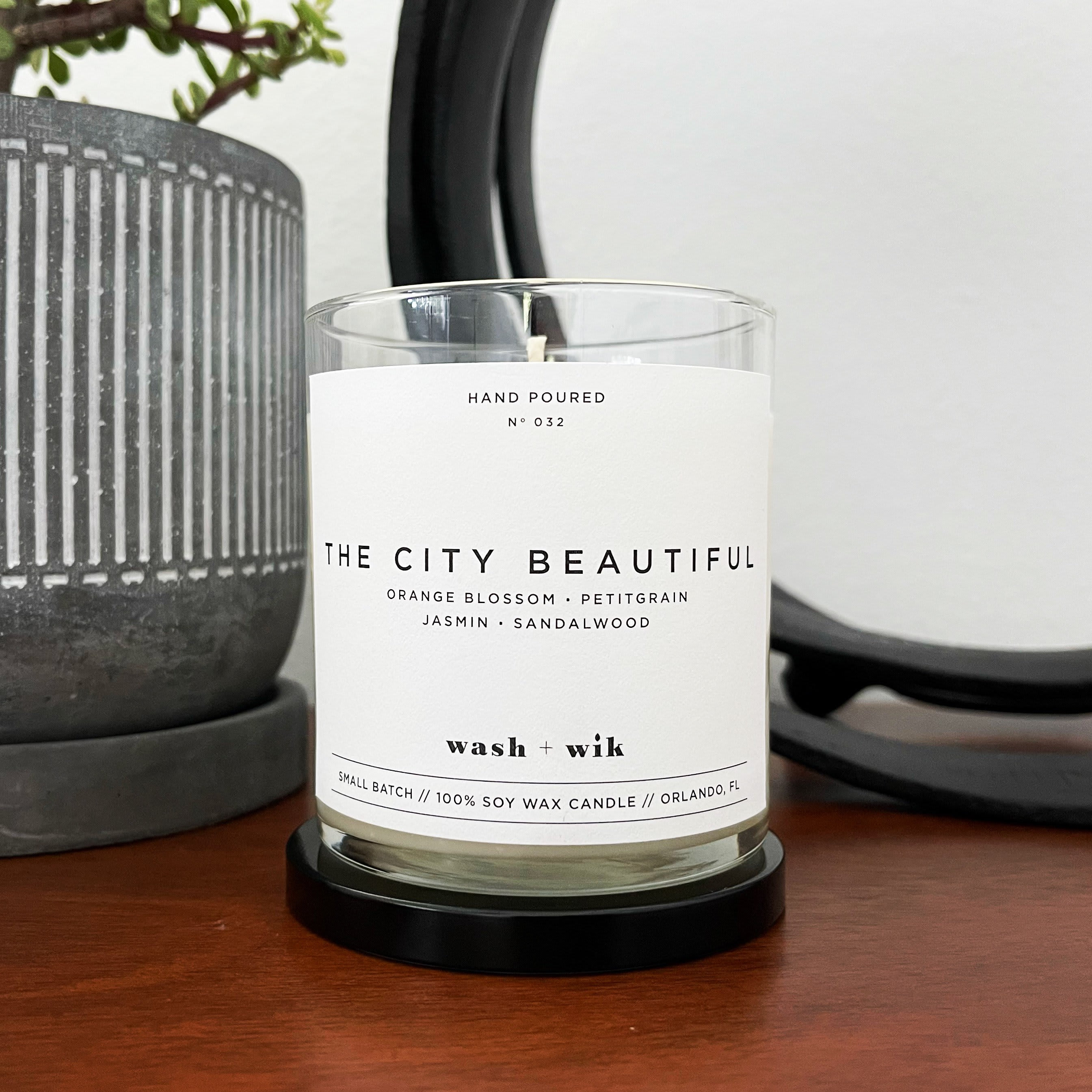 City Beautiful Soy Wax Candle - A hand-poured 100% soy wax candle with beautiful aromas of orange blossom, blood orange, grapefruit, bergamot, sandalwood, and beachwood. Wash + Wik wanted to make a candle that was an homage to their home, Orlando, Florida. Not from Orlando? We encourage you to bring a little bit of Orlando home with your next order!