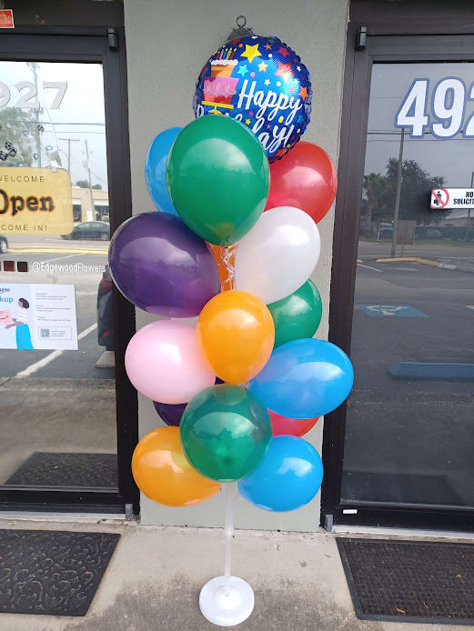 Colorful balloon bouquet with a Happy Birthday balloon on a stand
