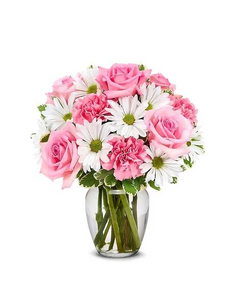 Pink roses and carnations with white daisies in a glass vase