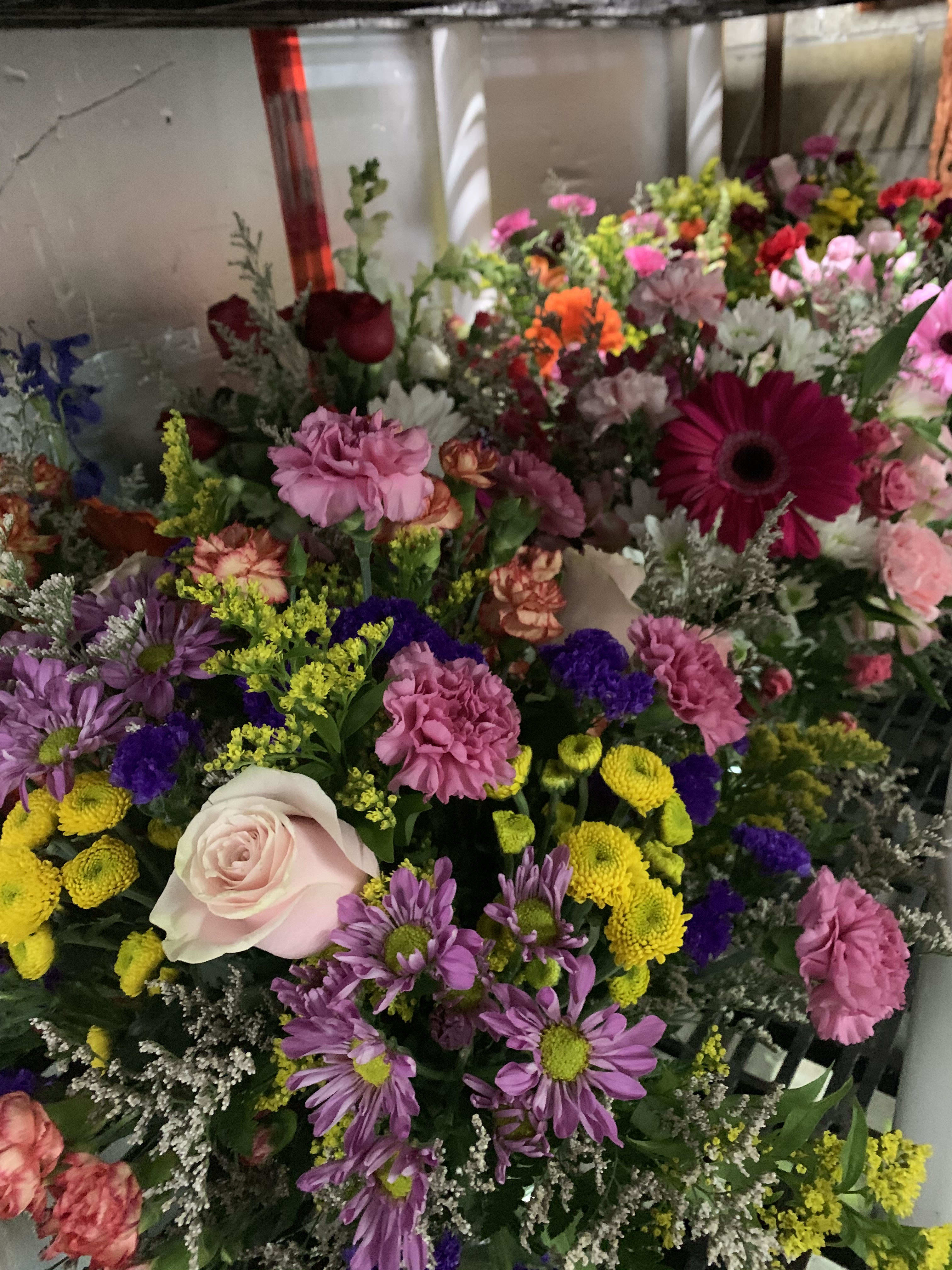 Mixed bouquet with pink, purple, yellow, and white flowers
