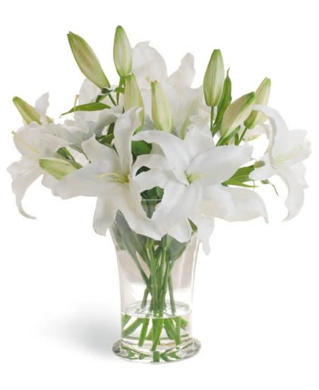 White lilies in a clear glass vase
