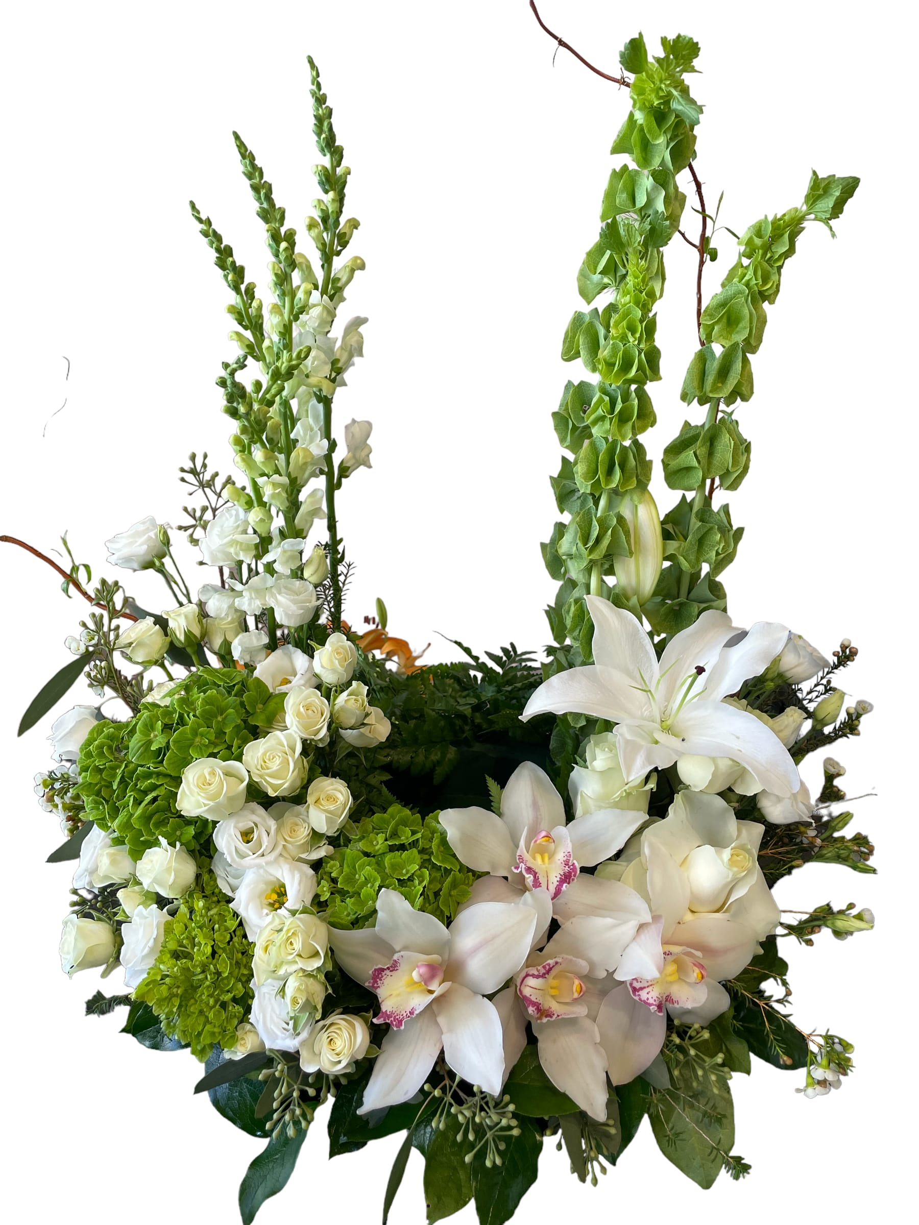 White floral arrangement with lilies, roses, and orchids