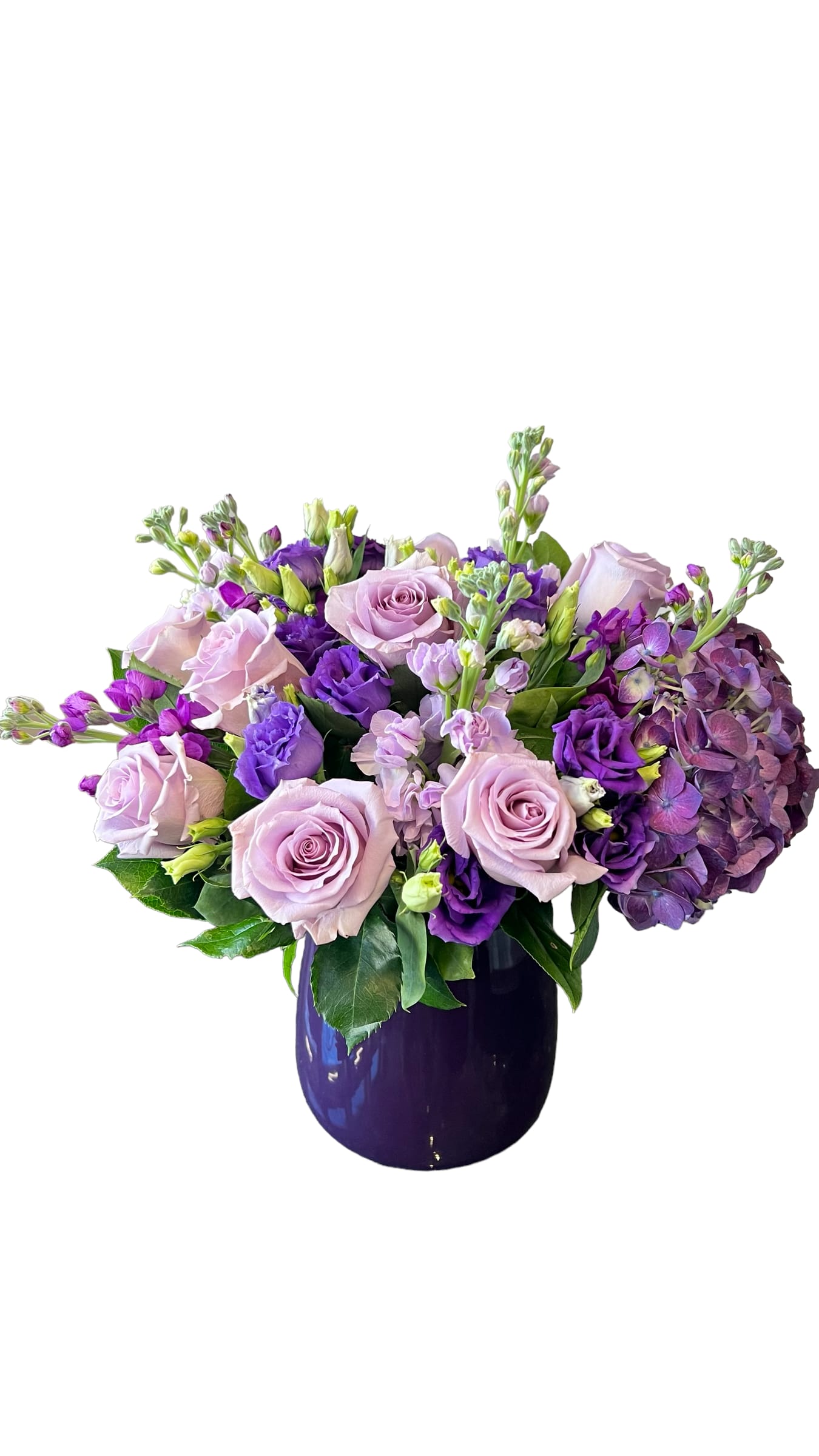 Lavender and purple bouquet in a dark vase