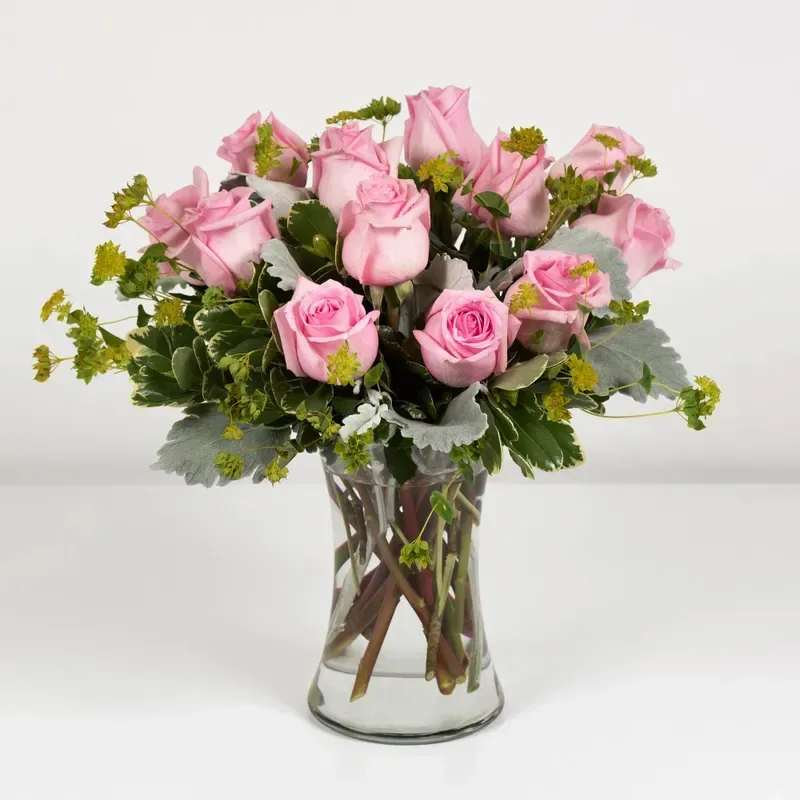 Pink Beauties - Send your sweetheart a sweet arrangement of a dozen pink roses, signifying grace and poetic love. 