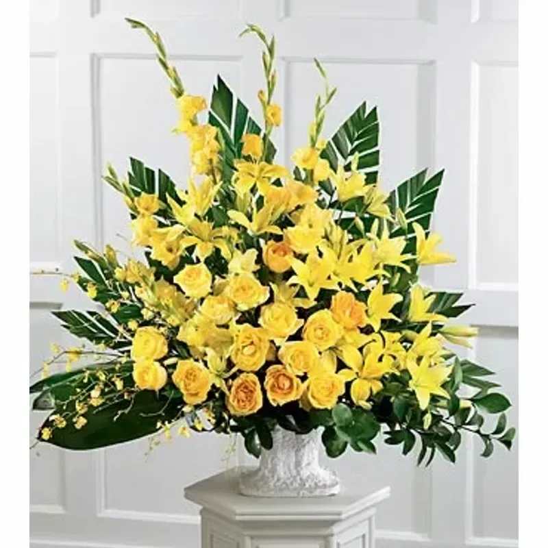 FTD® Golden Memories Arrangement™ - Golden roses, Asiatic lilies and yellow oncidium orchids nurture golden memories. A heartfelt expression of your sympathies. 