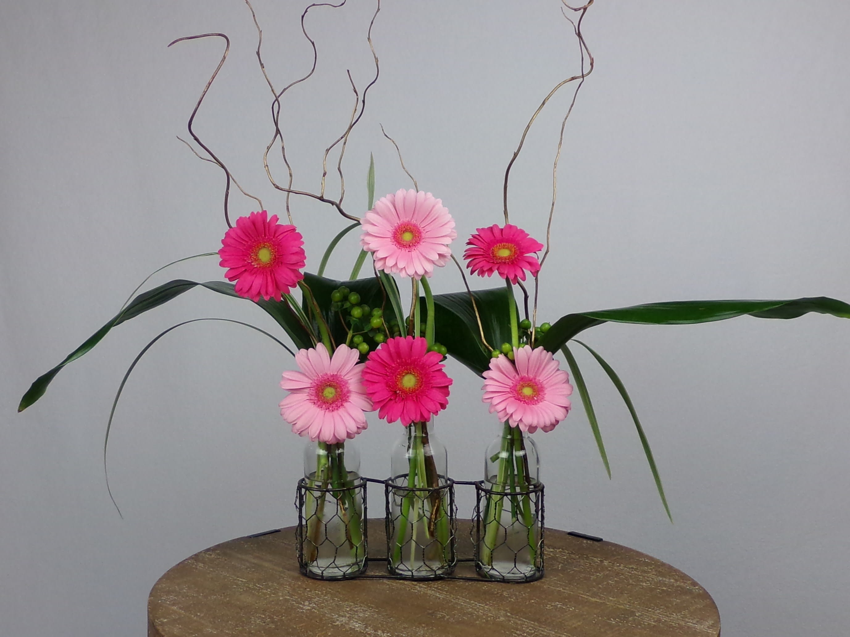 Cute as a button - vase trio with mini Gerber daisies lilli grass,willow branches ( Daisy colors may very)