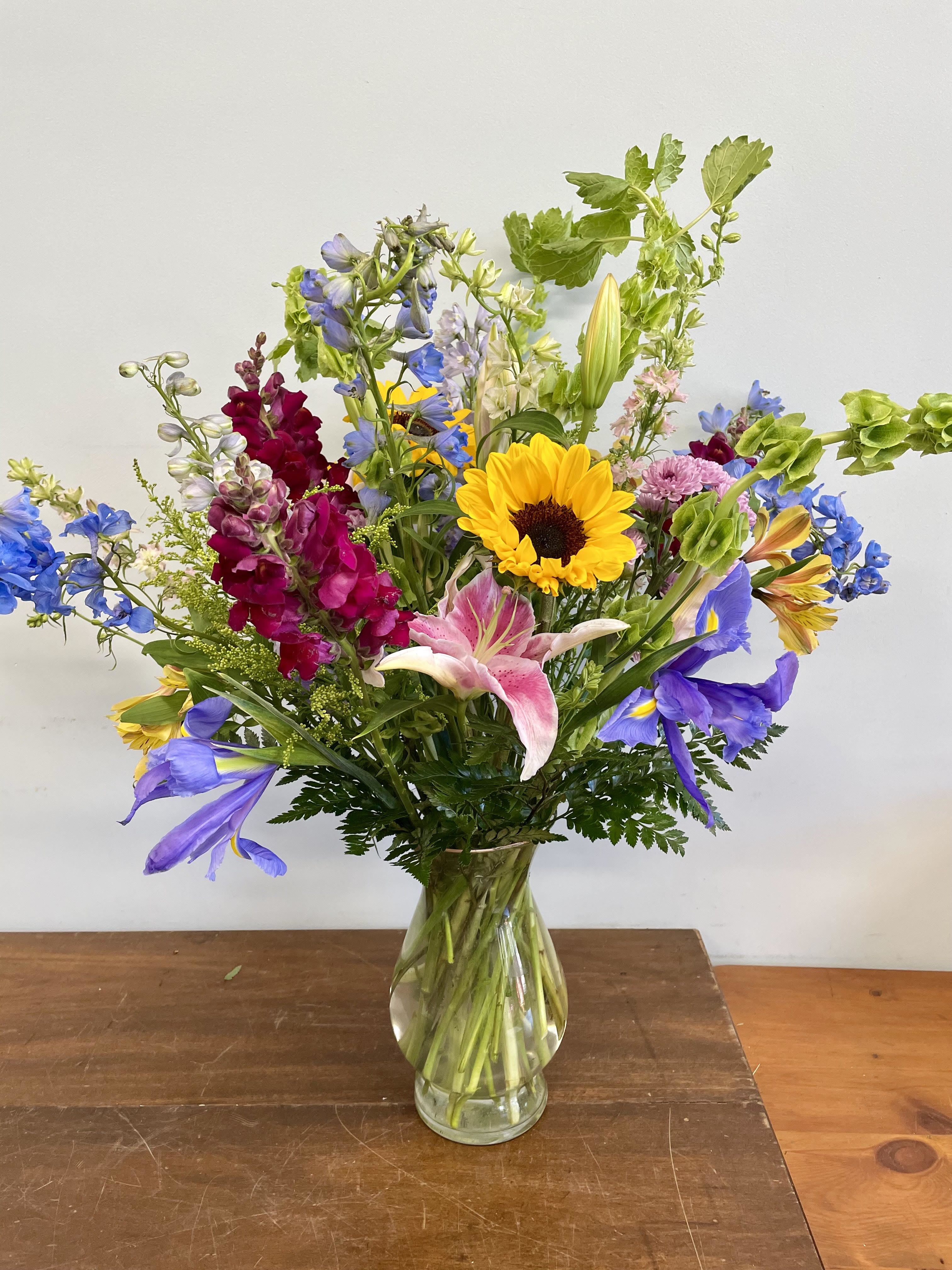 Colorful mixed bouquet in a clear glass vase