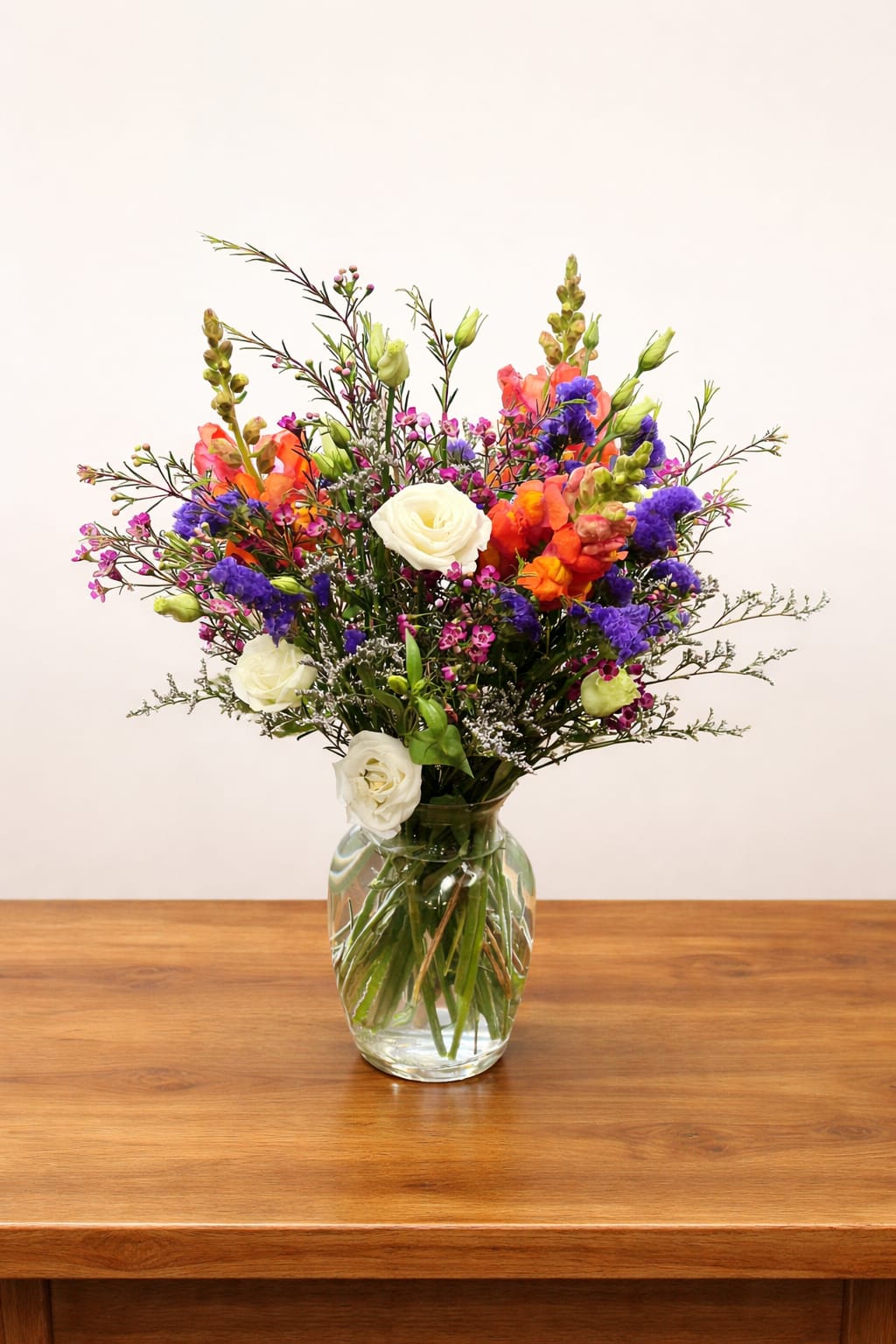 Colorful mixed bouquet in a clear glass vase