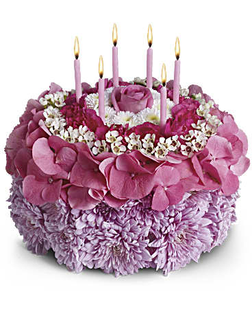 Your Special Day - Tell the birthday girl to make a wish on these candles! Made entirely of fresh flowers, this delightful "cake" will really make her day special.  The recipe for this cake includes a pink rose and hydrangea, hot pink miniature carnations, white button spray chrysanthemums and waxflower and lavender cushion spray chrysanthemums. This tasteful arrangement even comes with its own hot pink candles. It's everything a girl could wish for!