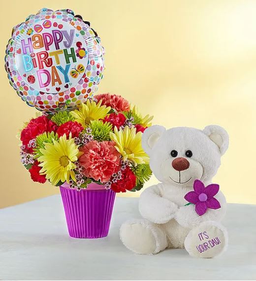 Lotsa Love Birthday Bouquet - Our amazing gift includes 3 fabulous gifts in one! It’s a value that will make them feel extra special, because when it’s their birthday, you want to send love …and lots of it! We’ve bundled a bright bouquet and balloon delivered by an adorable plush bear with a message on his paw: “It’s Your Day!” This all-inclusive party package is sure to make them beam on their big day. ** INCLUDES BALLON AND TEDDY BEAR **