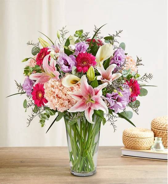 Majestic Moments - Send love to Mom in the most luxurious way. Our exquisite new bouquet is gathered with unique varieties, like calla lilies and hydrangeas, and accented by lush greenery. Designed in clear glass vase to let the beauty of each bloom shine, it’s a gift that captures this special moment, while making her feel like a queen.